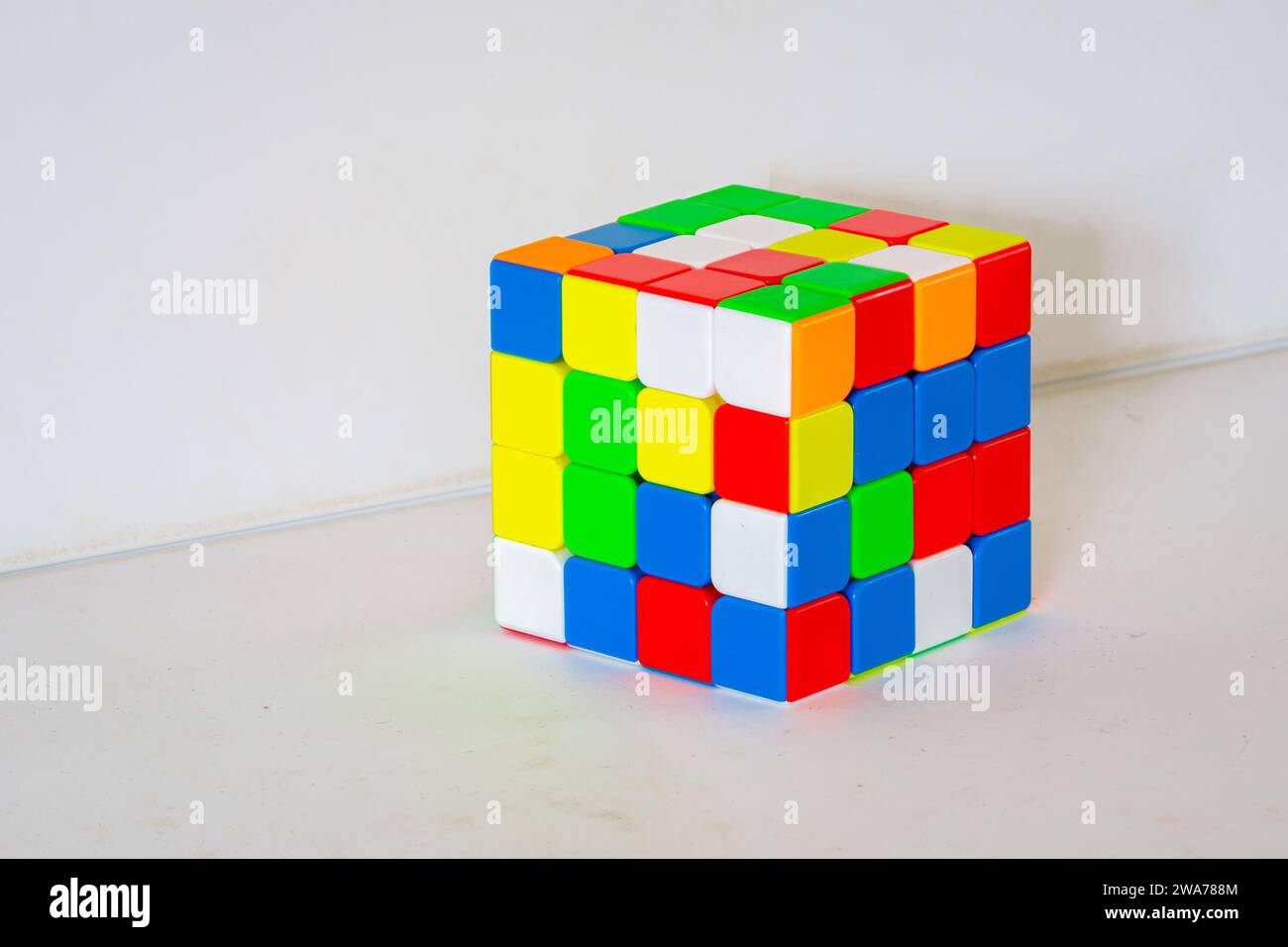 Scrambled, unsolved four by four toy cube Stock Photo