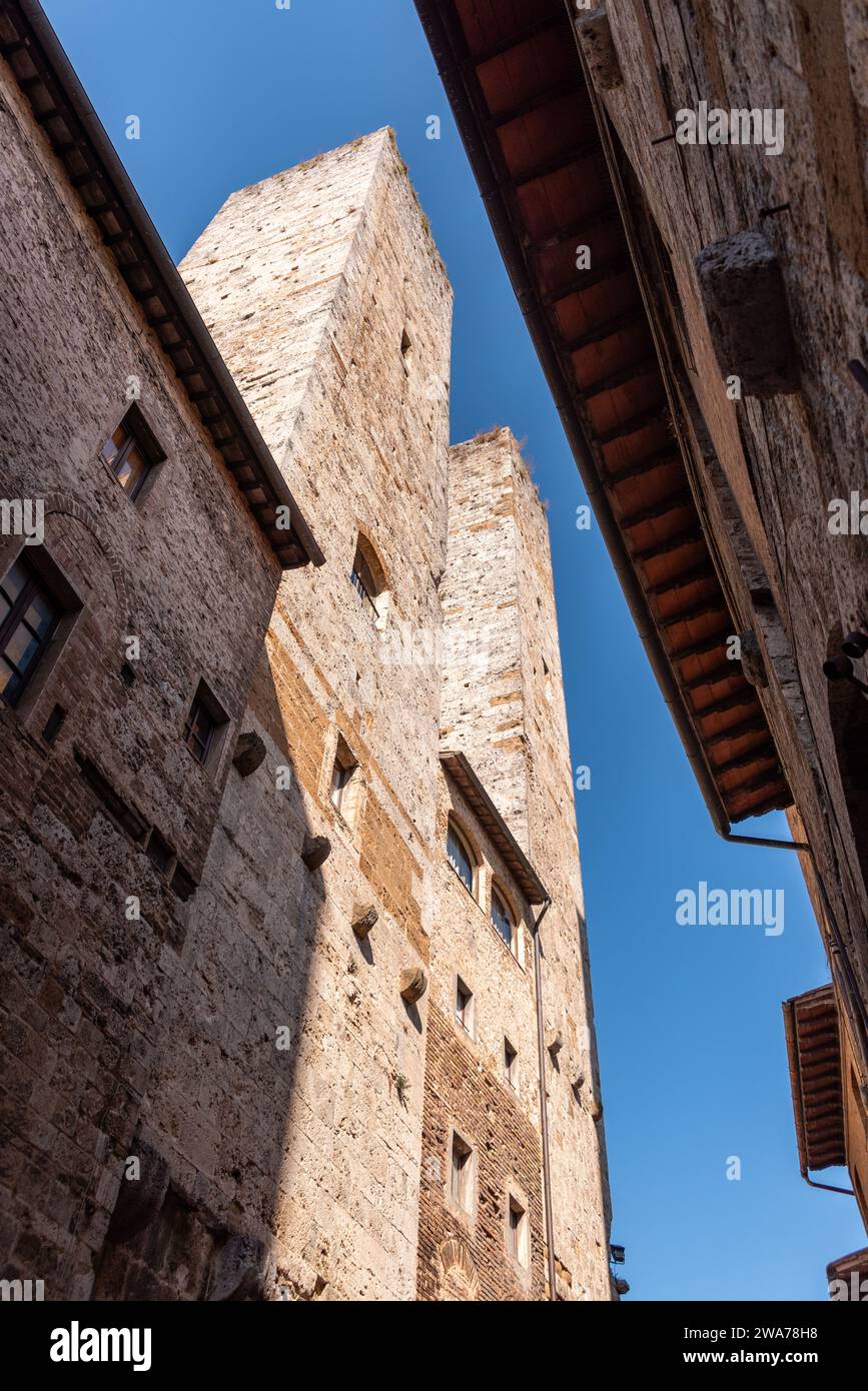 In the streets of San Gimignano, view on the towers Salvucci - Italy Stock Photo
