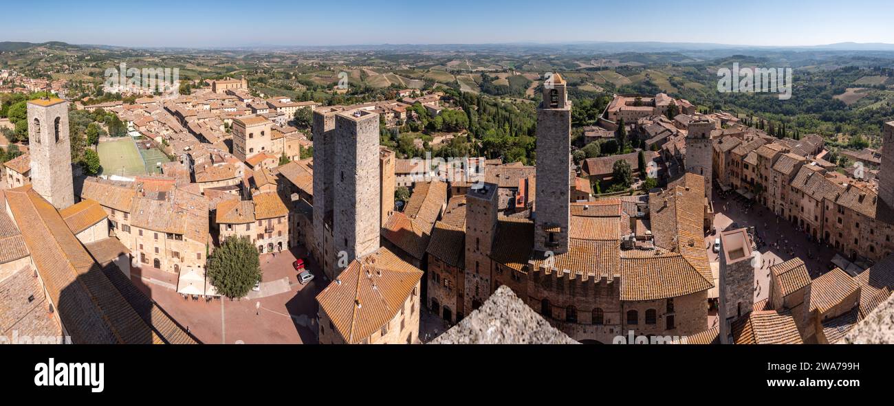Wide panoramic view over downtown San Gimignano, Torri dei Salvucci and Torre Rognosa in the center, seen from Torre Grosso, Italy Stock Photo