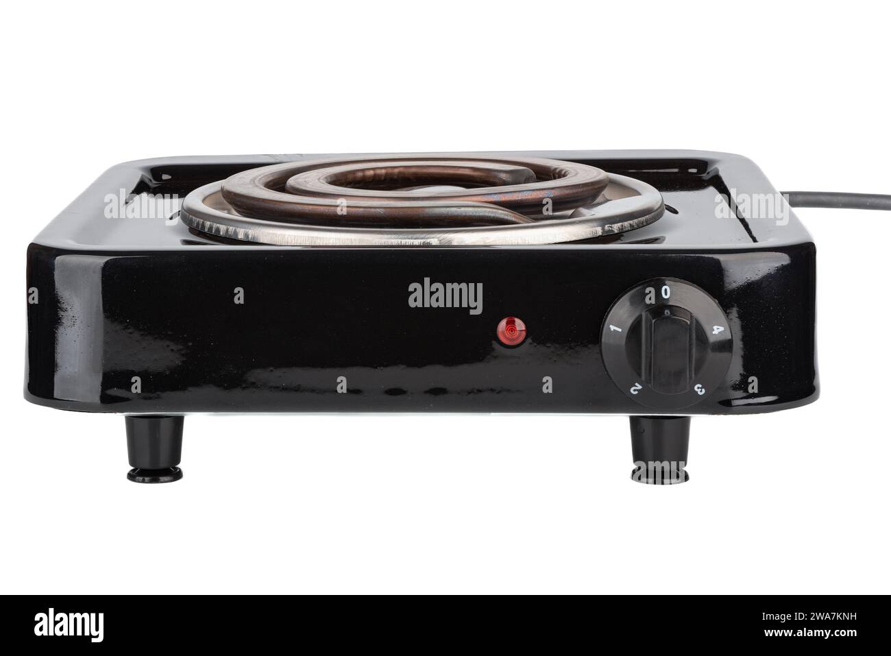 Tabletop electric stove with a spiral heating element on a white