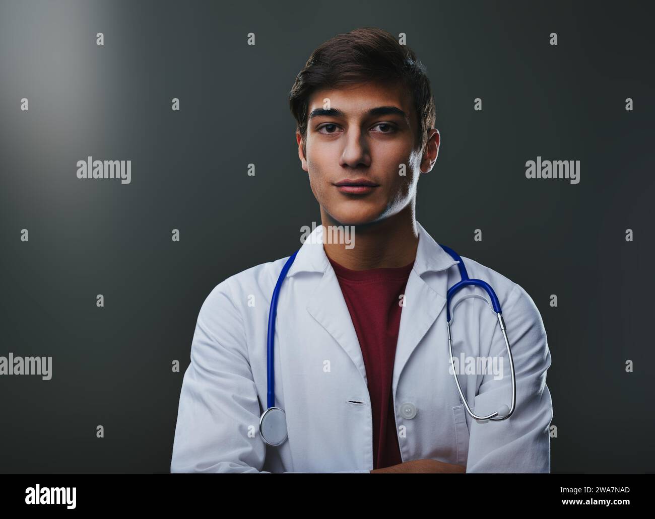 Poised in his white coat, the aspiring medic carries the essence of professionalism and the