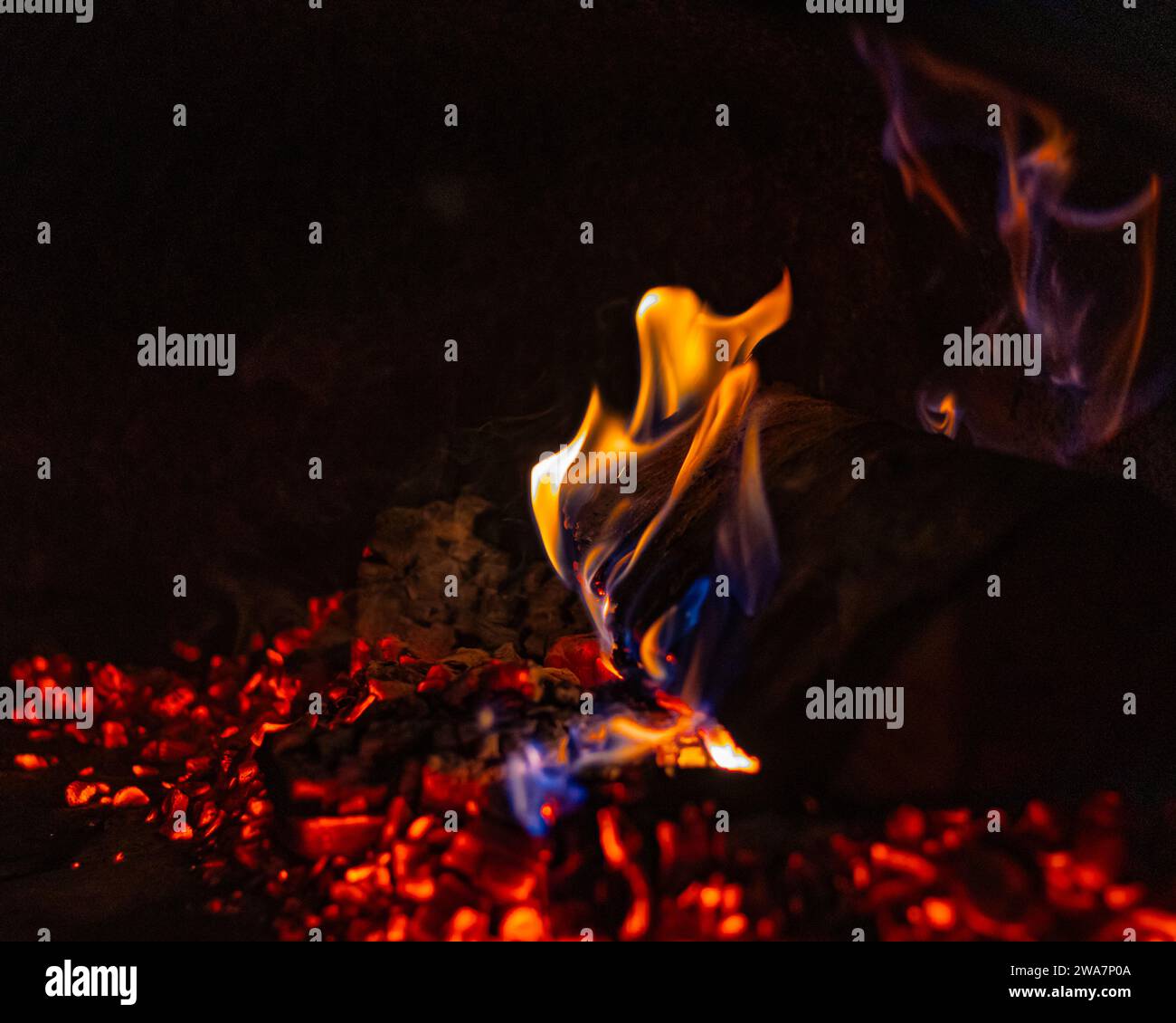 Crackling Flames of Burning Wood Logs in Traditional Fireplace Setting