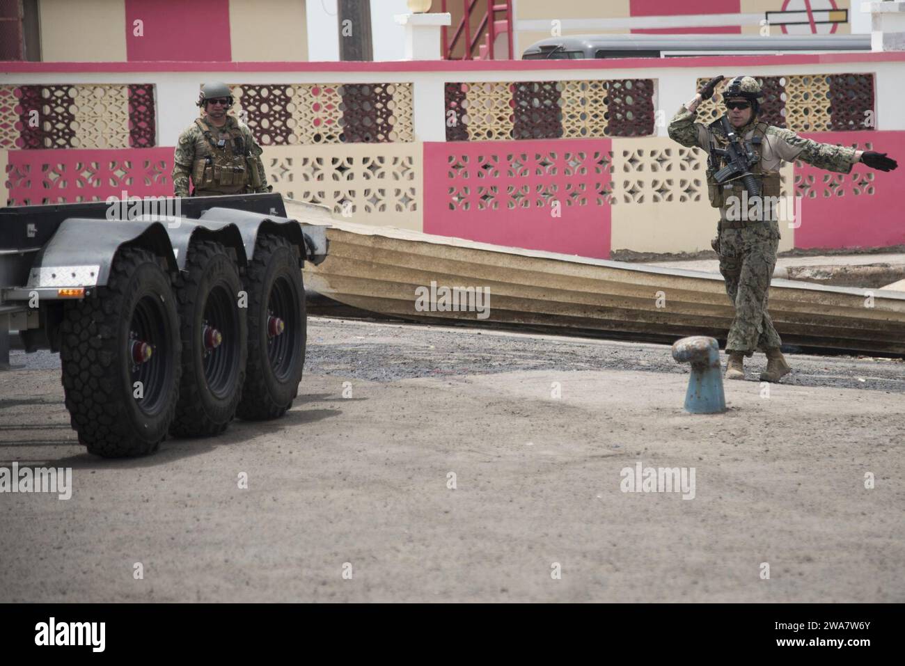 US military forces. 160714ZZ999-001 PORT DE PECHE, Djibouti (July 14, 2016) Senior Chief Boatswain’s Mate Dana Titchenell and Aviation Machinist’s Mate 2nd Class Scott Graham, from Coastal Riverine Squadron Eight, guide a trailer into the water to recover a 34-ft patrol boat at Port de Peche, Djibouti, July 14, 2016. U.S. 6th Fleet, headquartered in Naples, Italy, conducts the full spectrum of joint and naval operations, often in concert with allied, joint, and interagency partners, in order to advance U.S. national interests and security and stability in Europe and Africa. (U.S. photo by U.S. Stock Photo