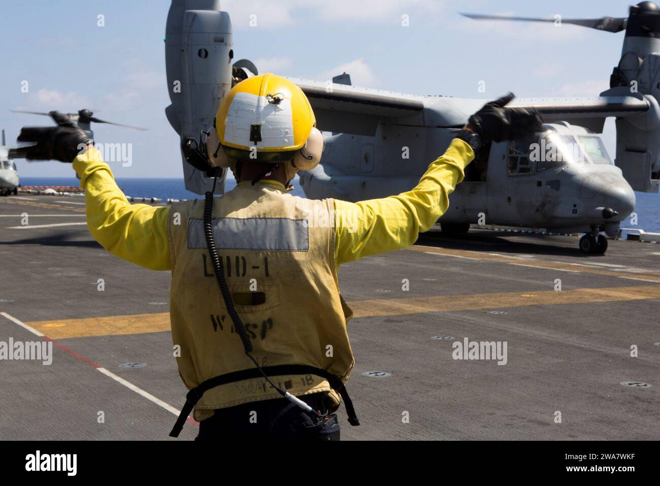 US military forces. 160728MK246-015 MEDITERRANEAN SEA (July 28, 2016) A Sailor assigned to the amphibious assault ship USS Wasp (LHD 1) guides an MV-22B Osprey from Marine Medium Tiltrotor Squadron 264 (Reinforced), 22nd Marine Expeditionary Unit (MEU), as it takes off from the flight deck of the Wasp, July 28, 2016. The 22nd MEU, deployed with the Wasp Amphibious Ready Group, is conducting naval operations in support of U.S. national security interests in Europe. (U.S. Marine Corps photo by Cpl. John A. Hamilton, Jr./Released) Stock Photo