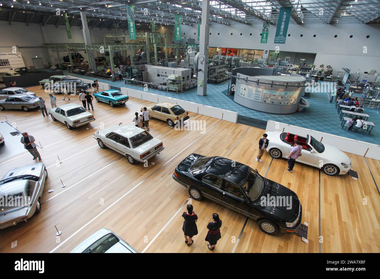 Inside the Toyota Commemorative Museum of Industry and Technology in Nagoya, Japan with a showroom of classic Toyota cars and historical machinery. Stock Photo