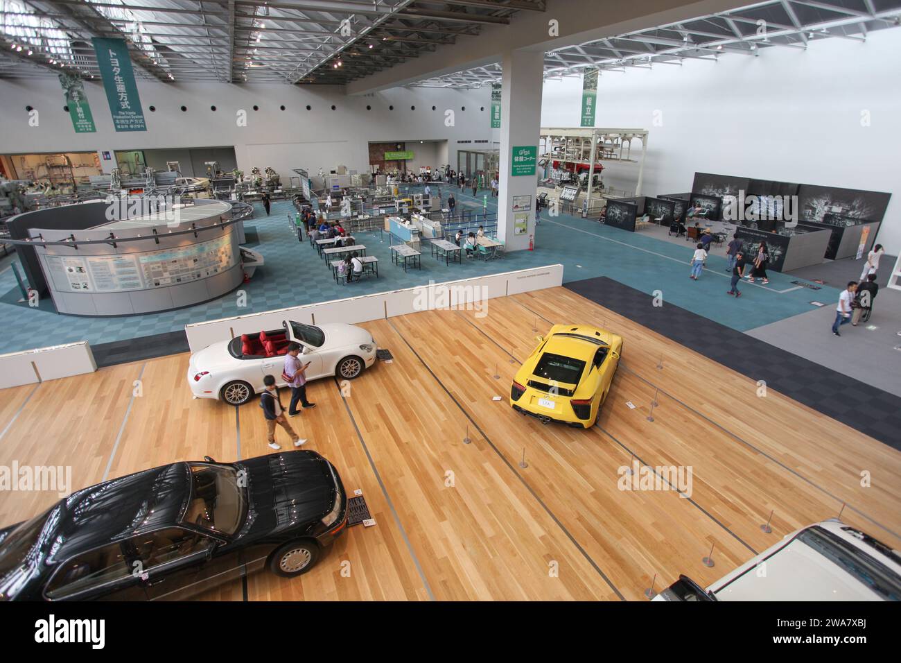 Inside the Toyota Commemorative Museum of Industry and Technology in Nagoya, Japan with a showroom of classic Toyota cars and historical machinery. Stock Photo