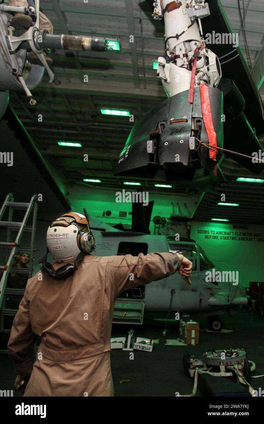 US military forces. 160810AF202-011 MEDITERRANEAN SEA (Aug. 10, 2016) Marines assigned to Marine Medium Tiltrotor Squadron 264 (Reinforced), 22nd Marine Expeditionary Unit (MEU), conduct maintenance on an MV-22B Osprey aboard the amphibious assault ship USS Wasp (LHD 1) on Aug. 10, 2016. 22nd MEU, deployed with the Wasp Amphibious Ready Group, is conducting naval operations in the 6th Fleet area of operations in support of U.S. national security interests in Europe and Africa. (U.S. Marine Corps photo by Lance Cpl. Koby I. Saunders/Released) Stock Photo