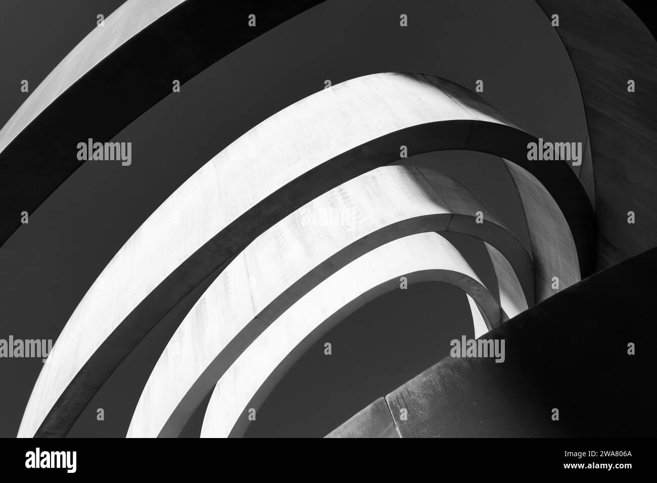 Striking monochrome architectural feature with sweeping curves and a