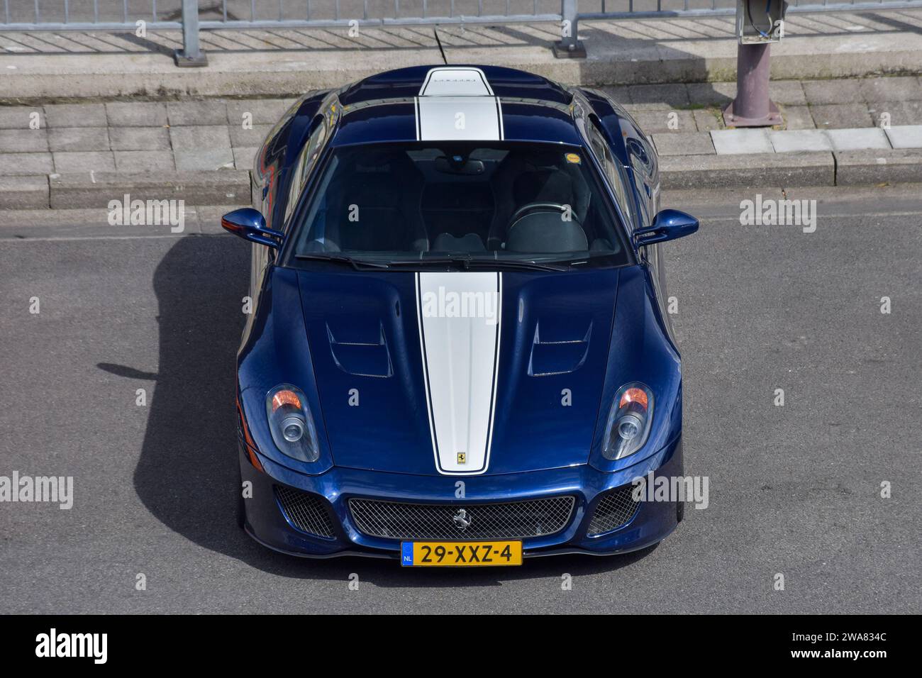 Stavelot, Belgium - Blue Le Mans and Bianco Avus Ferrari 599 GTO parked on a street view from above. Stock Photo