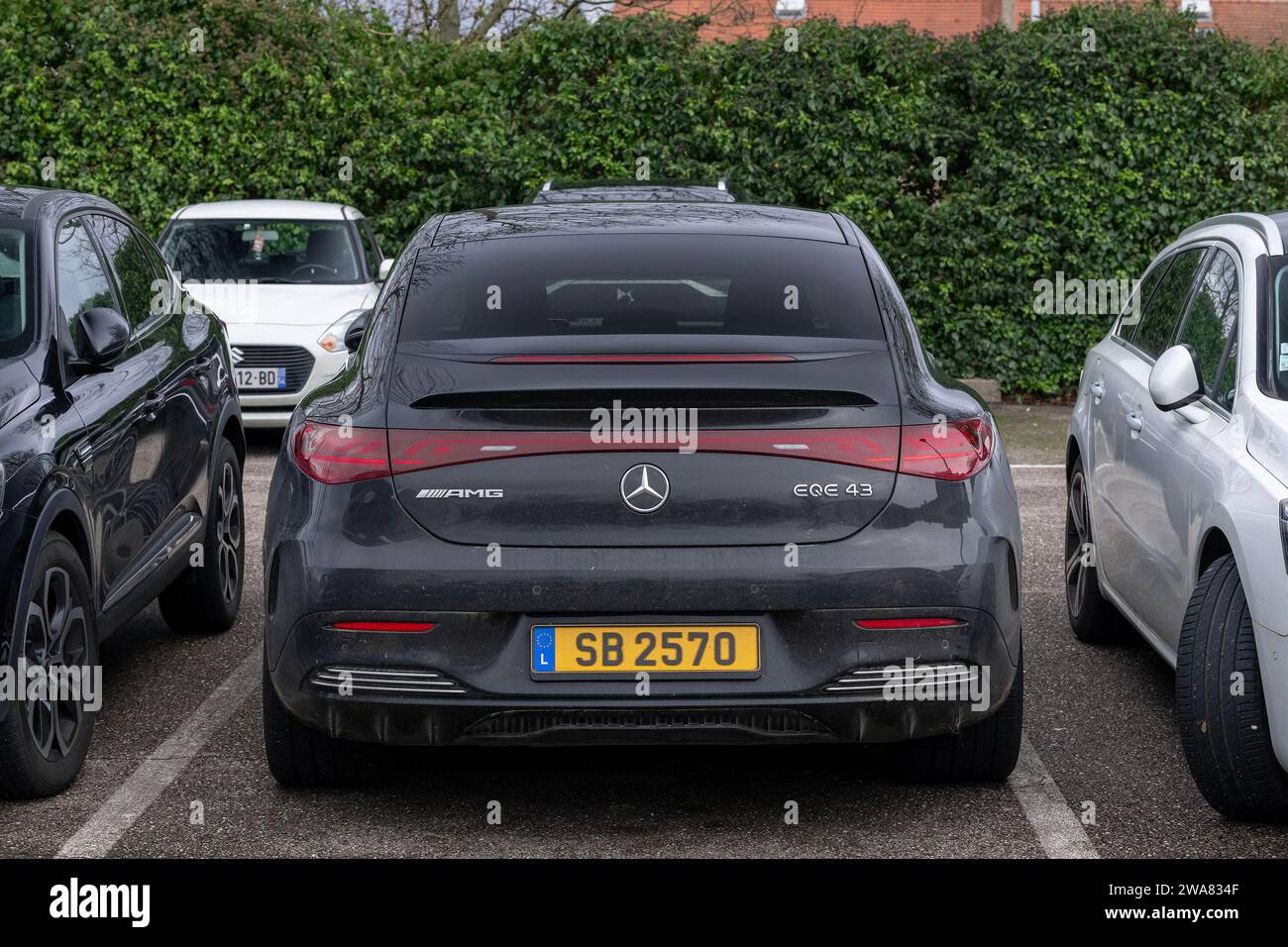 Nancy, France - Obsidian Black Metallic Mercedes-AMG EQE 43 4MATIC parked in a parking lot. Stock Photo