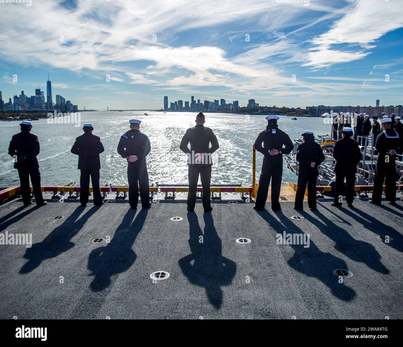 US military forces. 161110GD641-005 NEW YORK (Nov. 10, 2016) Marines and Sailors aboard the USS Iwo Jima (LHD-7) stand at parade rest while manning the rails as the ship docks at Port 88 in New York, Nov. 10, 2016. Marines with 1st Battalion, 8th Marine regiment, along with thousands of service members cross the armed forces are participating in Veterans Week New York City 2016 to honor the service of all the nation’s veterans. (U.S. Marine Corps photo by Sgt. Anthony Mesa/Released)) Stock Photo