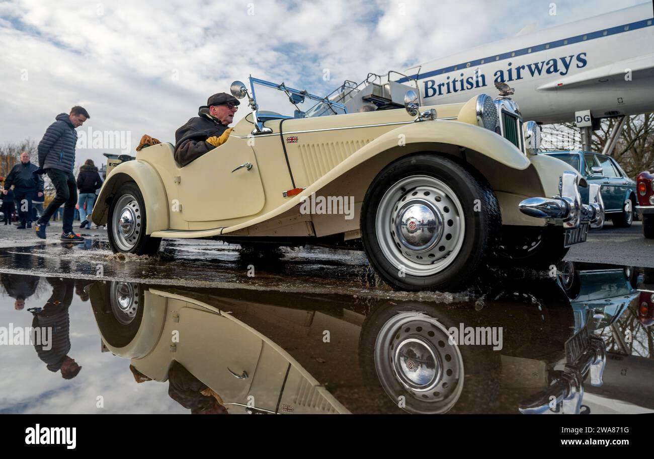 MG TD classic car passes Concorde at Brooklands New Years Day show