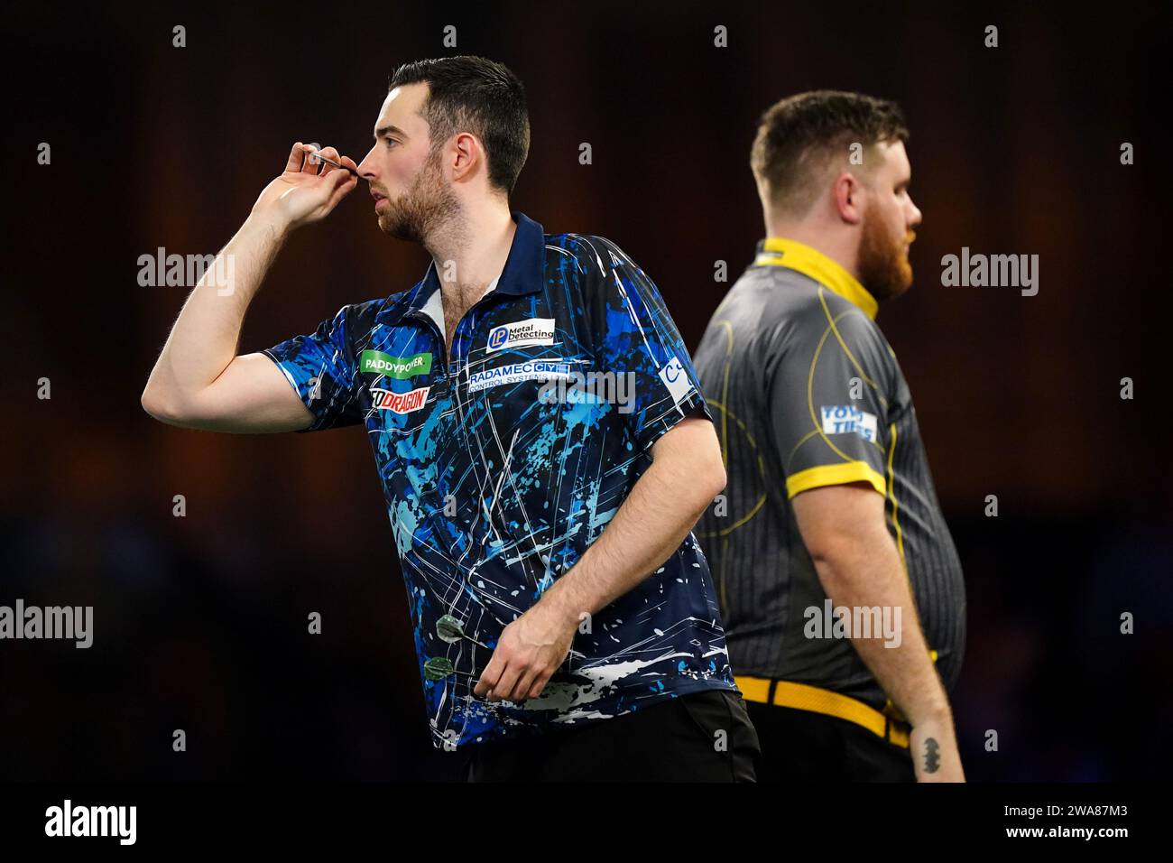 Luke Humphries in action against Scott Williams (right) on day fifteen
