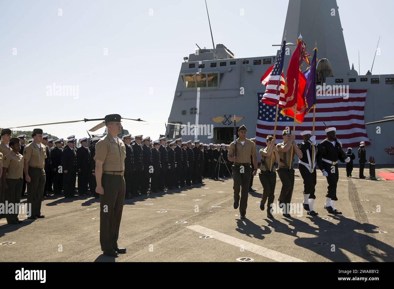 US military forces. 170505OC926-036 SOUDA BAY, Greece (May 5, 2017) The joint color guard of the 24th Marine Expeditionary Unit (MEU) and amphibious transport dock ship USS Mesa Verde (LPD 19) parades across the flight deck during a change of command ceremony May 5, 2017. The 24th MEU is underway with the Bataan Amphibious Ready Group in support of maritime security operations and theater security cooperation efforts in the U.S. 6th Fleet area of operations. (U.S. Marine Corps photo by Cpl. Hernan Vidaña) Stock Photo