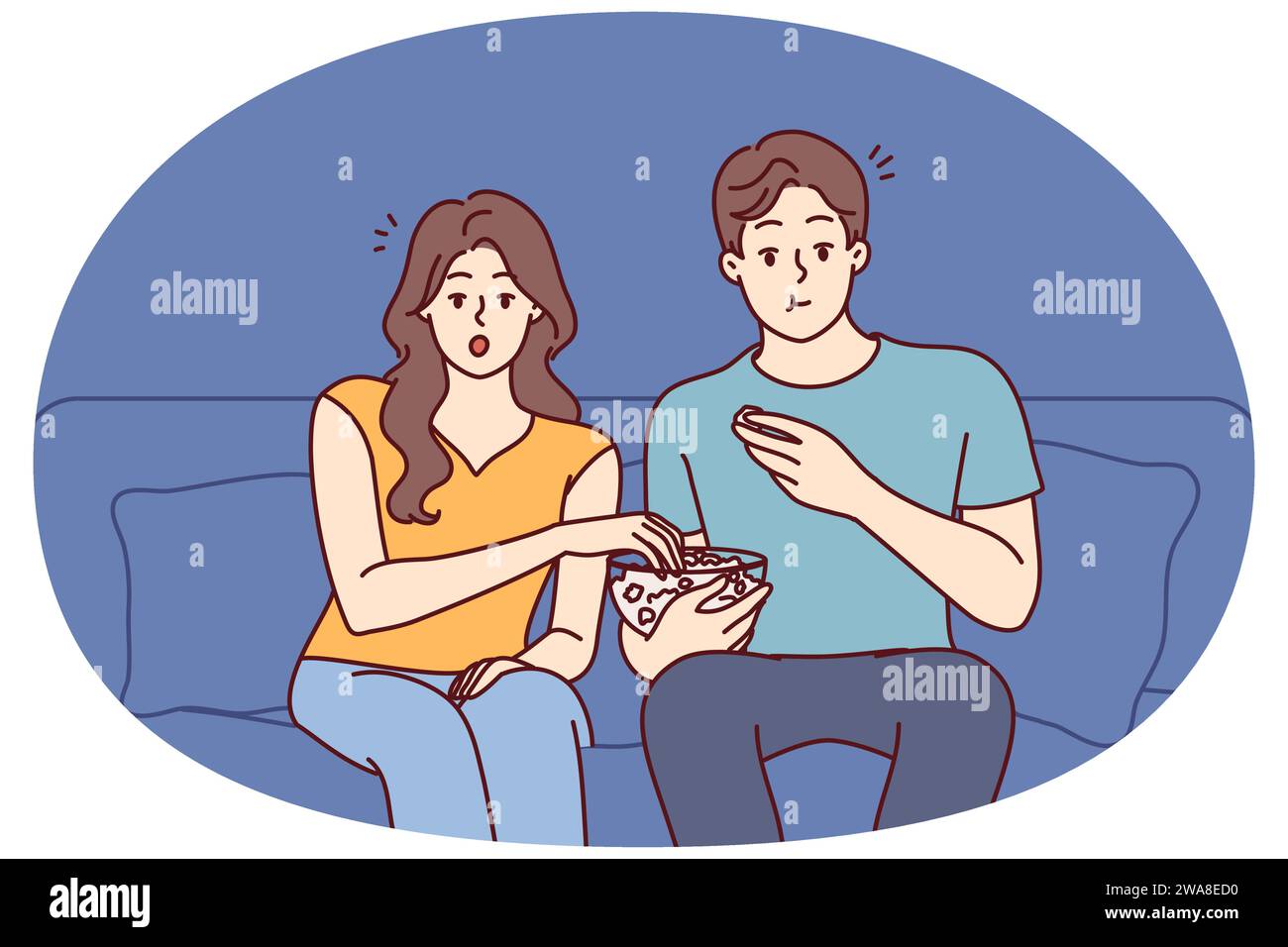 Couple watching movie eating popcorn at home. Young man and woman relax ...