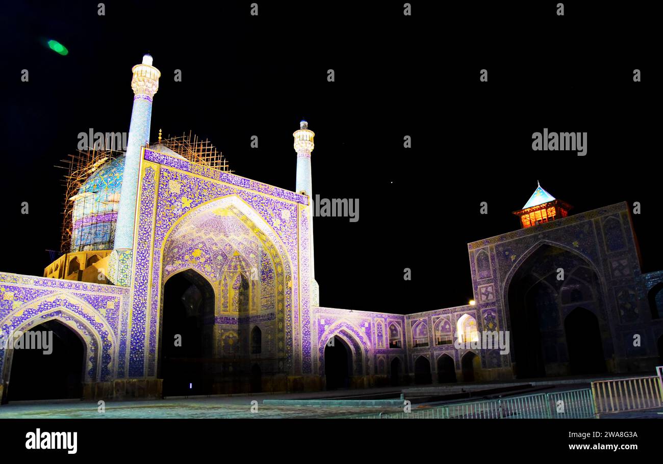 Stunning view of Shah mosque at night at the Naqsh-e Jahan Square (Emam Square), Isfahan, Iran.  A bright lone star hangs in the background. Stock Photo