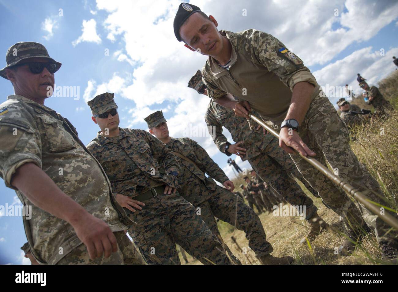 US military forces. 170715QX735-0016 SHIROKYI LAN, Ukraine (July 15, 2017)- - Ukrainian soldiers instruct U.S. Marines with 3rd Battalion, 23rd Marine Regiment, on use of a mine-clearing tool, July 15, in Shirokyi Lan, Ukraine, during exercise Sea Breeze 2017.  Sea Breeze is a U.S. and Ukraine co-hosted multi-national air, land and maritime exercise designated to strengthen the collective security, stability, and safety in the Black Sea. (U.S. Marine Corps photo by Staff Sgt. Marcin Platek/Released) Stock Photo