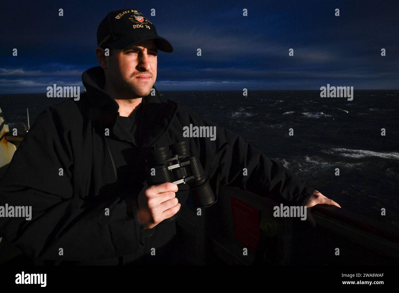 US military forces. 171017UY653-384  ATLANTIC OCEAN (Oct. 17, 2017) Lt. j.g. Andrew Cooper monitors the sea state from aboard the Arleigh Burke-class guided-missile destroyer, USS Oscar Austin (DDG 79), Oct. 17, 2017. Oscar Austin is on a routine deployment supporting U.S. national security interests in Europe, and increasing theater security cooperation and forward naval presence in the U.S. 6th Fleet area of operations. (U.S. Navy photo by Mass Communication Specialist 2nd Class Ryan Utah Kledzik/Released) Stock Photo