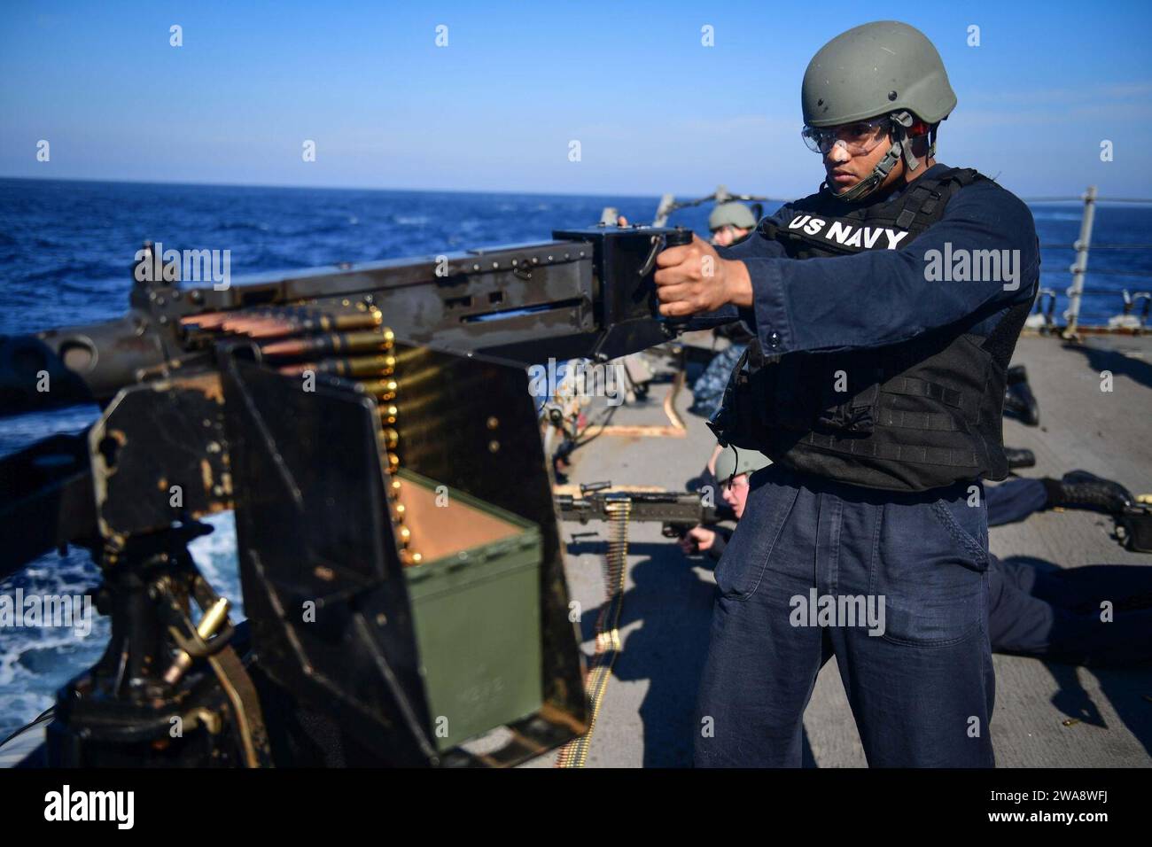 US military forces. 171021GX781-178 MEDITERRANEAN SEA (Oct. 21, 2017) - Sonar Technician (Surface) 3rd Class Ricardo Valdez, from Vallejo, California, fires a .50 caliber machine gun during a live-fire exercise aboard the Arleigh Burke-class guided-missile destroyer USS James E. Williams (DDG 95) Oct. 21, 2017.  James E. Williams, home-ported in Norfolk, is on a routine deployment to the U.S. 6th Fleet area of operations in support of U.S. national security interests in Europe. (U.S. Navy photo by Mass Communication Specialist 3rd Class Colbey Livingston/ Released) Stock Photo