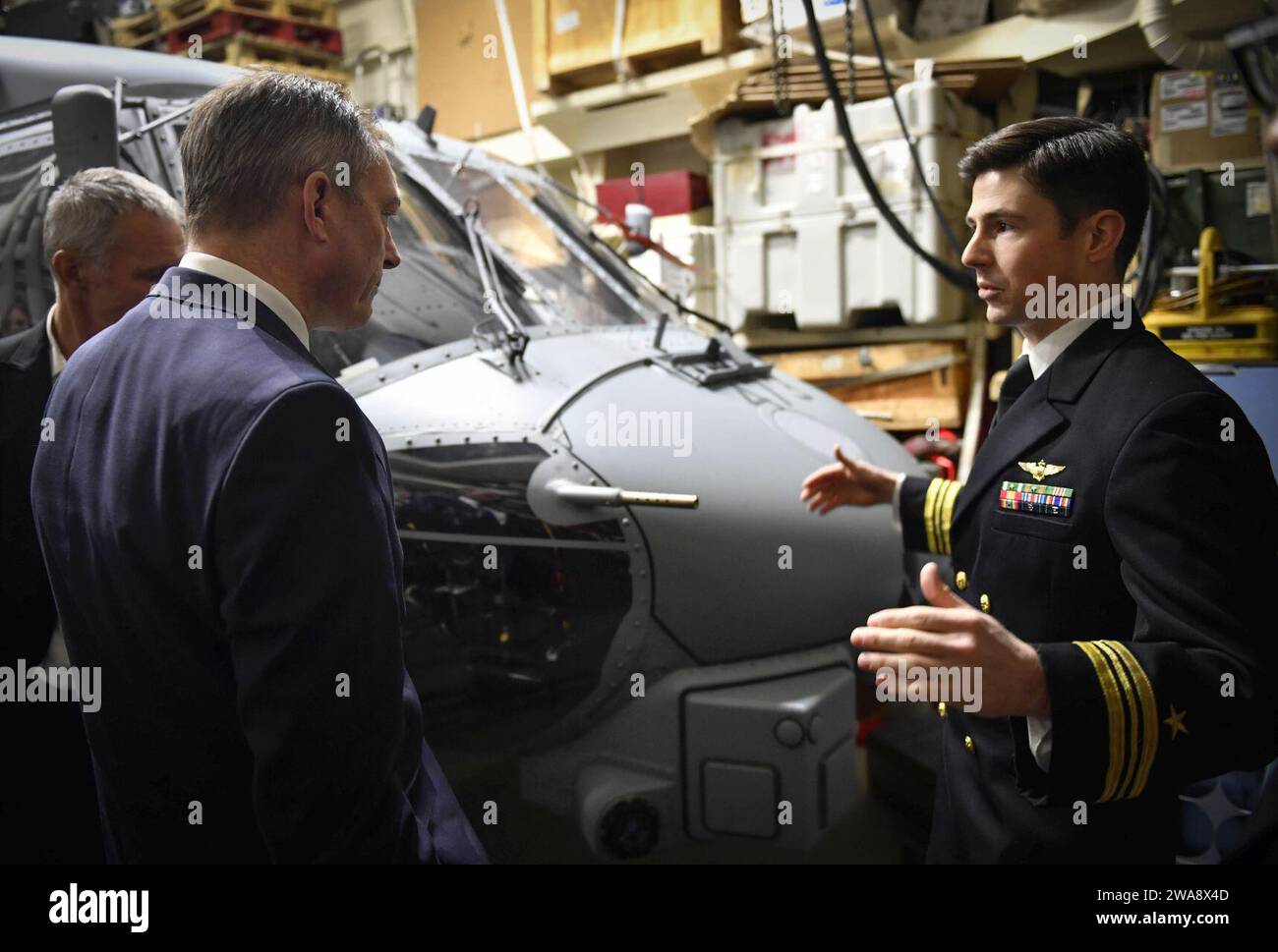 US military forces. 171030UY653-046  OSLO, Norway (Oct. 30, 2017) Lt. Cmdr. Michael Sullivan,  assigned to the 'Grandmasters' of Helicopter Maritime Strike Squadron (HSM) 46, gives a tour of an MH-60R Sea Hawk helicopter to Norwegian Defense Minister Frank Bakke-Jensen  aboard the Arleigh Burke-class guided-missile destroyer USS Oscar Austin (DDG 79) Oct. 30, 2017. Oscar Austin is on a routine deployment supporting U.S. national security interests in Europe, and increasing theater security cooperation and forward naval presence in the U.S. 6th Fleet area of operations. (U.S. Navy photo by Mass Stock Photo