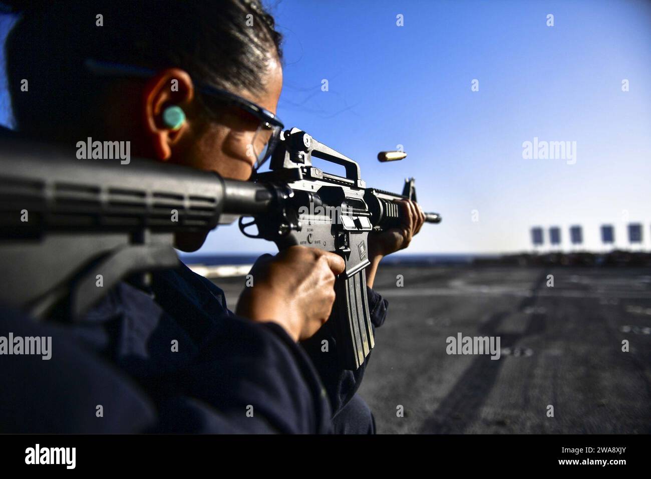 US military forces. 171108BK384-462 MEDITERRANEAN SEA (Nov. 8, 2017) Seaman Joanna Valdez, from Fontana, California, and assigned to the deck department aboard the San Antonio-class amphibious transport dock ship USS San Diego (LPD 22), fires an M4A1 Carbine during a live-fire training exercise on the ship’s flight deck Nov. 8, 2017. San Diego is deployed with the America Amphibious Ready Group and the 15th Marine Expeditionary Unit to support maritime security and theater security cooperation in efforts in the U.S. 6th Fleet area of operations. (U.S. Navy photo by Mass Communication Specialis Stock Photo
