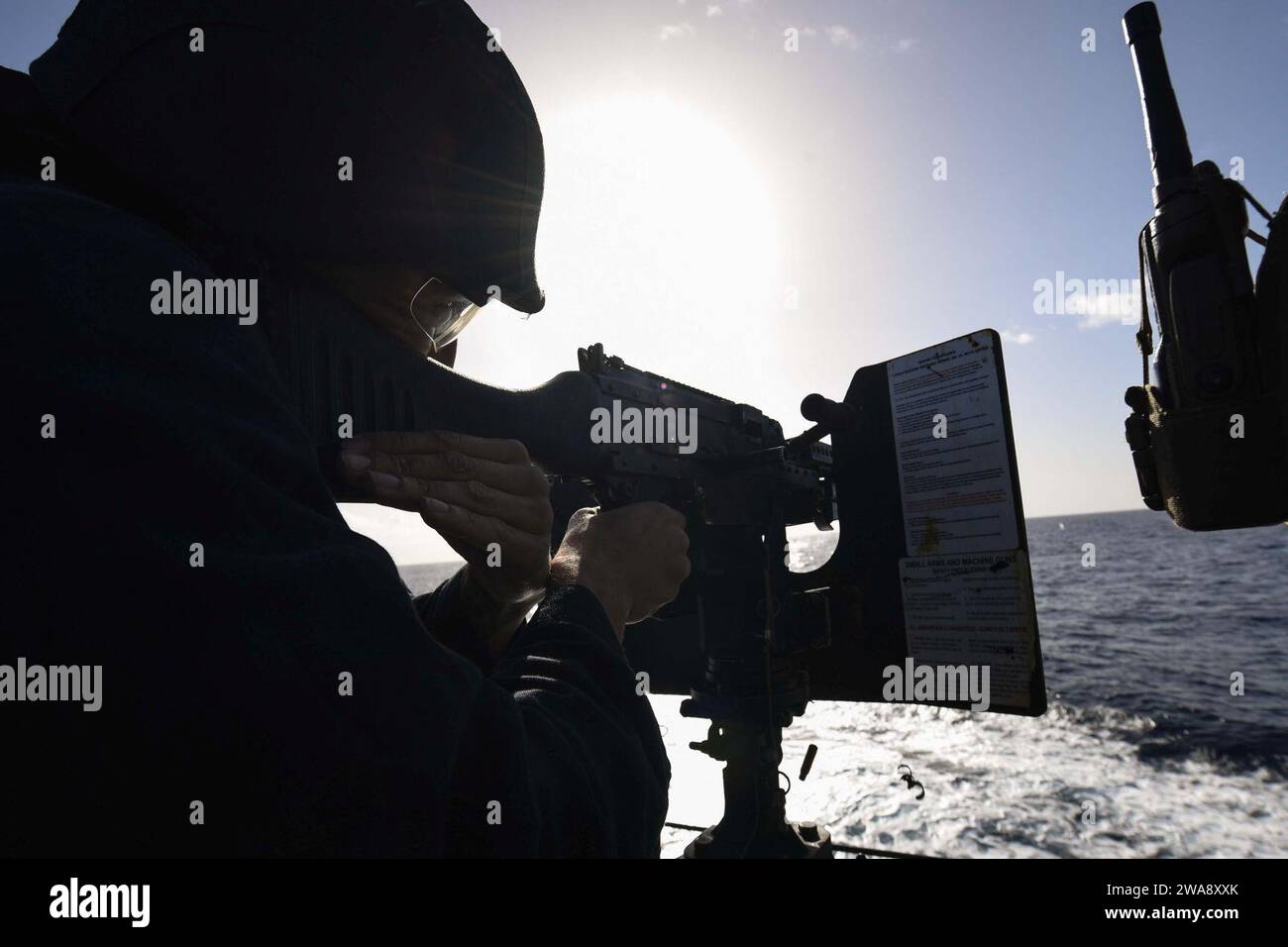 US military forces. 171114FP878-111 MEDITERRANEAN SEA (Nov. 14, 2017) Logistics Specialist 2nd Class Gabriel Flores, from Atwater, California, fires an M240B machine gun during a crew-served weapons shoot aboard the Arleigh Burke-class guided-missile destroyer USS Donald Cook (DDG 75) Nov. 14, 2017. Donald Cook, forward-deployed to Rota, Spain, is on its sixth patrol in the U.S. 6th Fleet area of operations in support of regional allies and partners, and U.S. national security interests in Europe.  (U.S. Navy photo by Mass Communication Specialist 1st Class Theron J. Godbold /Released) Stock Photo