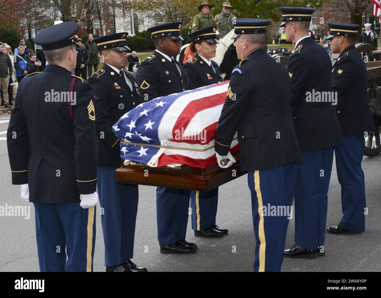 US military forces. CONCORD, Mass. (Nov. 15, 2017) The Military Funeral Honors Team of the Massachusetts Army National Guard carries the casket of Medal of Honor Recipient Capt. Thomas J. Hudner, Jr., during a funeral procession in Capt. Hudner’s honor. Capt. Hudner, a naval aviator, received the Medal of Honor for his actions during the Battle of the Chosin Reservoir during the Korean War. (U.S. Navy photo by Mass Communication Specialist 3rd Class Casey Scoular/Released) Stock Photo