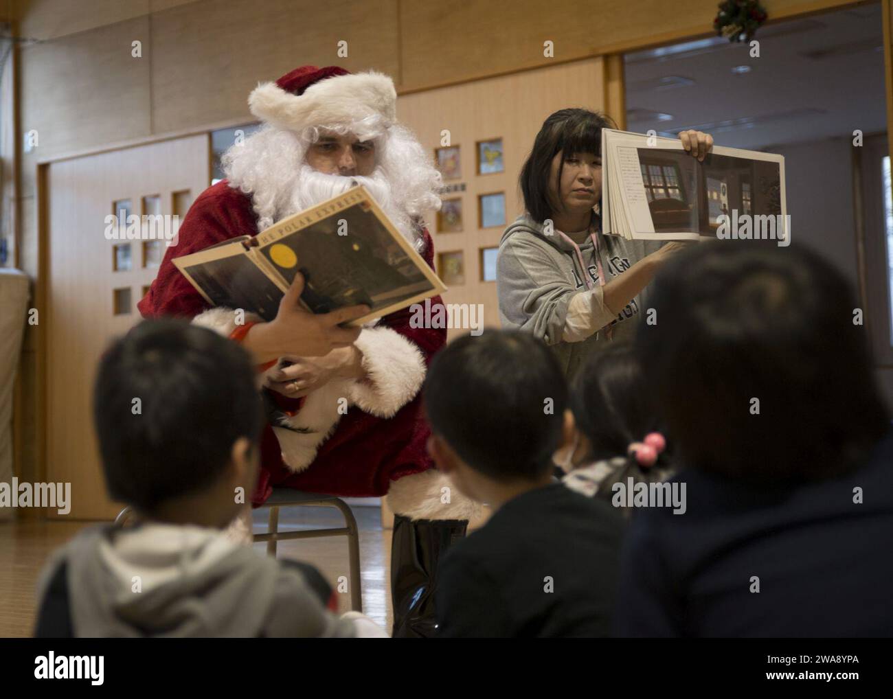 US military forces. 171218DA275-058 MISAWA, Japan (Dec. 18, 2017) Legalman 1st Class Donald McDowell, assigned to Naval Air Facility Misawa (NAFM), visits children at the Ohzora Jido-Kan, a Japanese after school care center, dressed as Santa Claus for a special holiday themed visit. Sailors from NAFM volunteer to make bi-weekly visits to the after school care center as part of community relations efforts. (U.S. Navy photo by Mass Communication Specialist 3rd Class Samuel Bacon/Released) Stock Photo