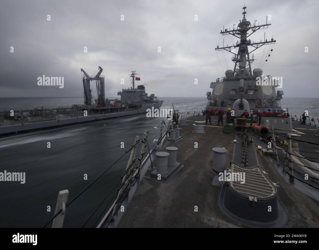 US military forces. 180217RG482-214 BLACK SEA (Feb. 17, 2018) The Arleigh Burke-class guided-missile destroyer USS Ross (DDG 71) steams alongside the Turkish Akar-class replenishment oiler TCG Yuzbasi Kudret Gungor (A 595) during a refueling-at-sea Feb. 17, 2018 in the Black Sea. Ross, forward-deployed to Rota, Spain, is on its sixth patrol in the U.S. 6th Fleet area of operations in support of regional allies and partners and U.S. national security interests in Europe. (U.S. Navy photo by Mass Communication Specialist 1st Class Kyle Steckler/Released) Stock Photo