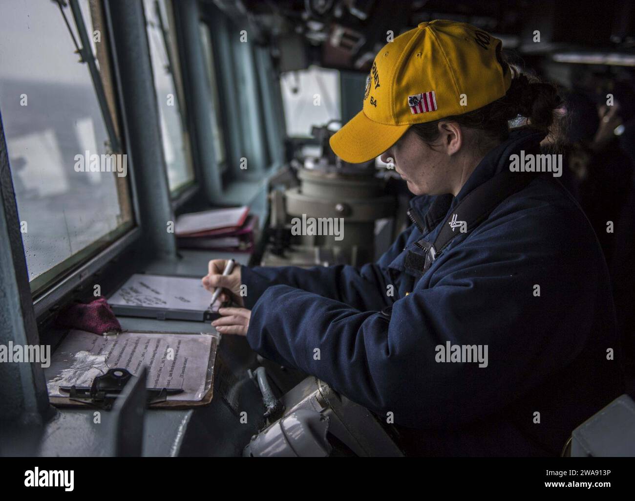 US military forces. 180224KA046-0024  BLACK SEA (Feb. 24, 2018) – Ensign Rachel Sell stands watch as officer of the deck aboard the Arleigh Burke-class guided-missile destroyer USS Carney (DDG 64) in the Black Sea, Feb. 24, 2018. Carney, forward-deployed to Rota, Spain, is on its fourth patrol in the U.S. 6th Fleet area of operations in support of regional allies and partners, and U.S. national security interests in Europe. (U.S. Navy photo by Mass Communication Specialist 2nd Class James R. Turner/Released) Stock Photo