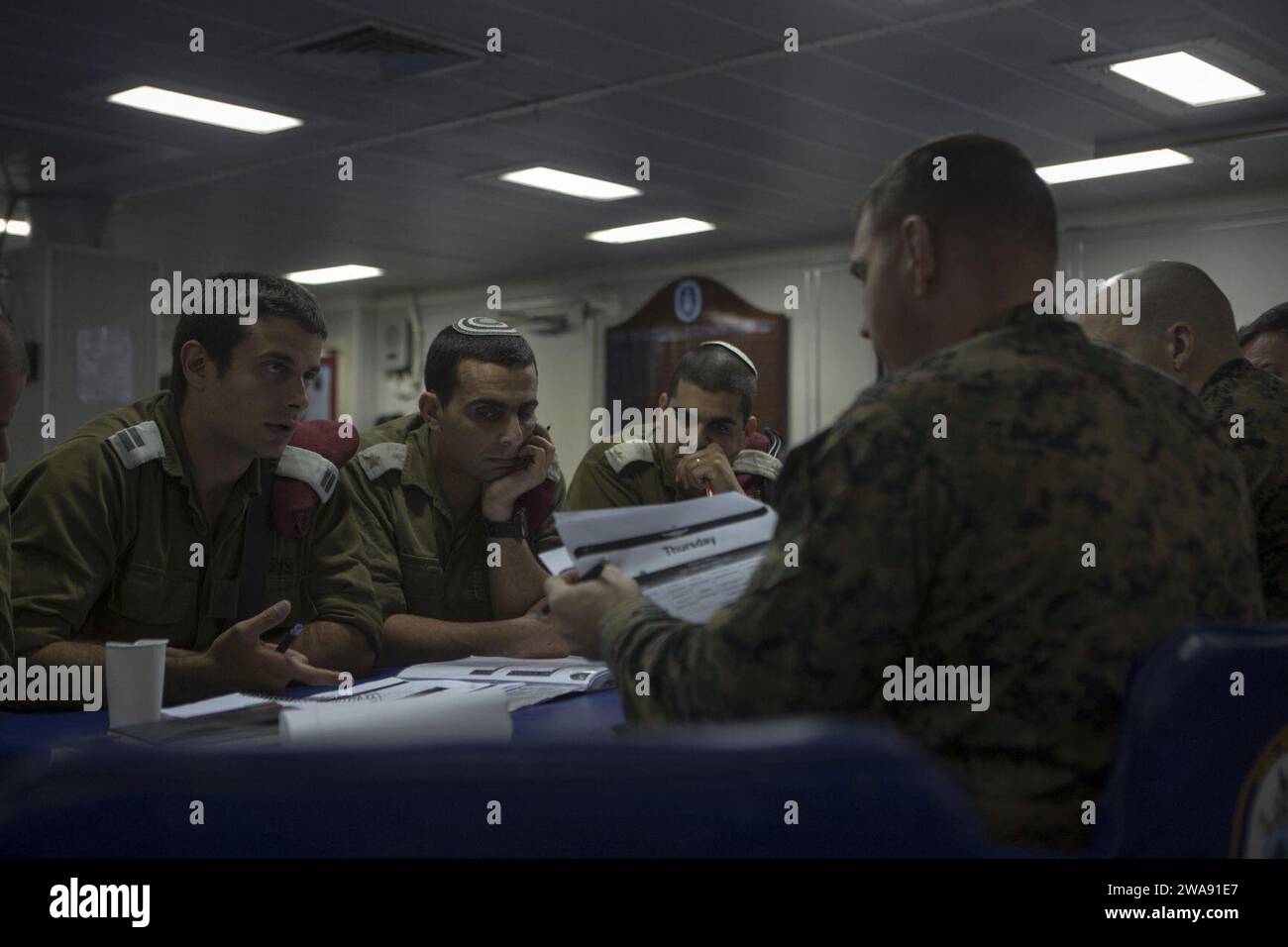 US military forces. 180306IZ659-0007 MEDITERRANEAN SEA (Mar. 6, 2018) U.S. Marine Corps leadership of Battalion Landing Team, 2nd Battalion, 6th Marine Regiment (BLT 2/6), 26th Marine Expeditionary Unit (MEU), discuss details about the upcoming bilateral exercise Juniper Cobra with Israeli Defense Force (IDF) soldiers aboard the Wasp-class amphibious assault ship USS Iwo Jima (LHD 7), Mar. 6, 2018. JC18 is a combined exercise designed to improve interoperability between US and Israeli forces. (U.S. Marine Corps photo by Cpl. Santino D. Martinez/Released) Stock Photo