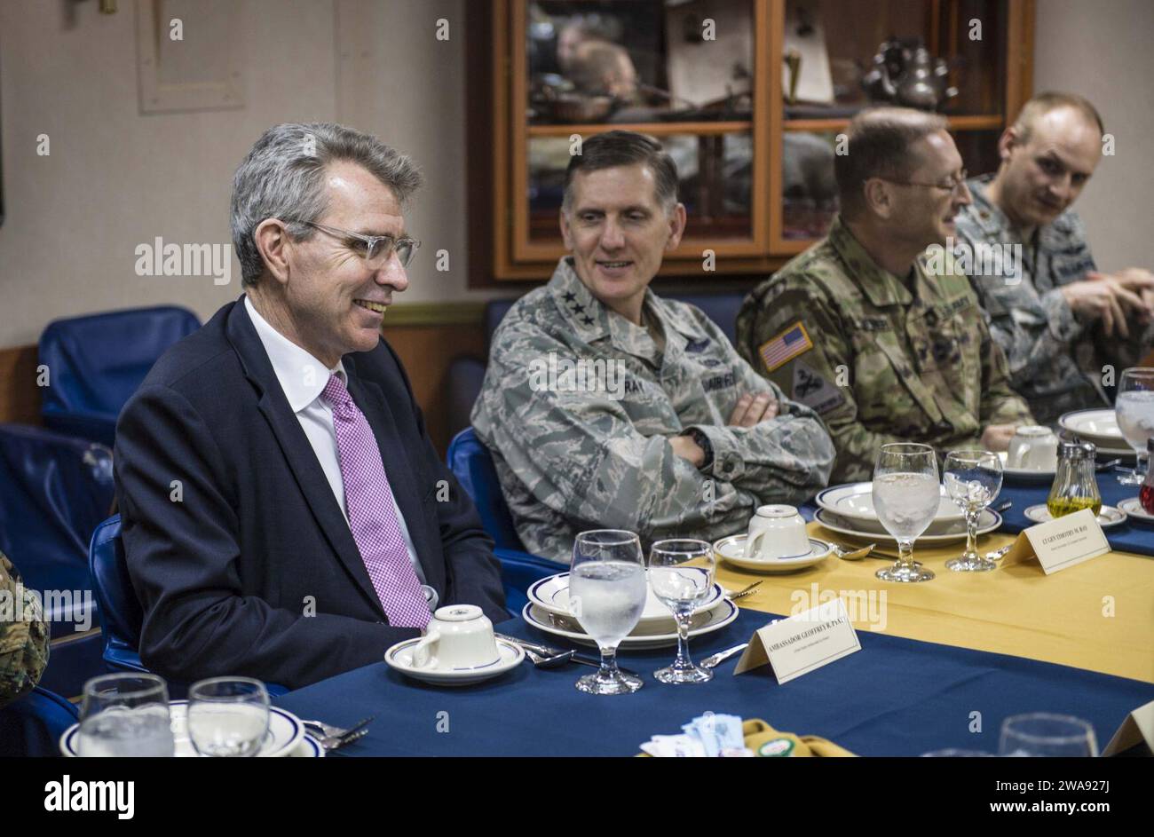 US military forces. 180319KA046-0215  NAVAL SUPPORT ACTIVITY SOUDA BAY, Greece (March 19, 2018) – U.S. Ambassador to Greece Geoffrey Pyatt, left, and U.S. Air Force Lt. Gen. Timothy Ray eat lunch aboard the Arleigh Burke-class guided-missile destroyer USS Carney (DDG 64)  at Naval Support Activity Souda Bay, Greece, March 19, 2018. Carney, forward-deployed to Rota, Spain, is on its fourth patrol in the U.S. 6th Fleet area of operations in support of regional allies and partners, and U.S. national security interests in Europe and Africa. (U.S. Navy photo by Mass Communication Specialist 2nd Cla Stock Photo