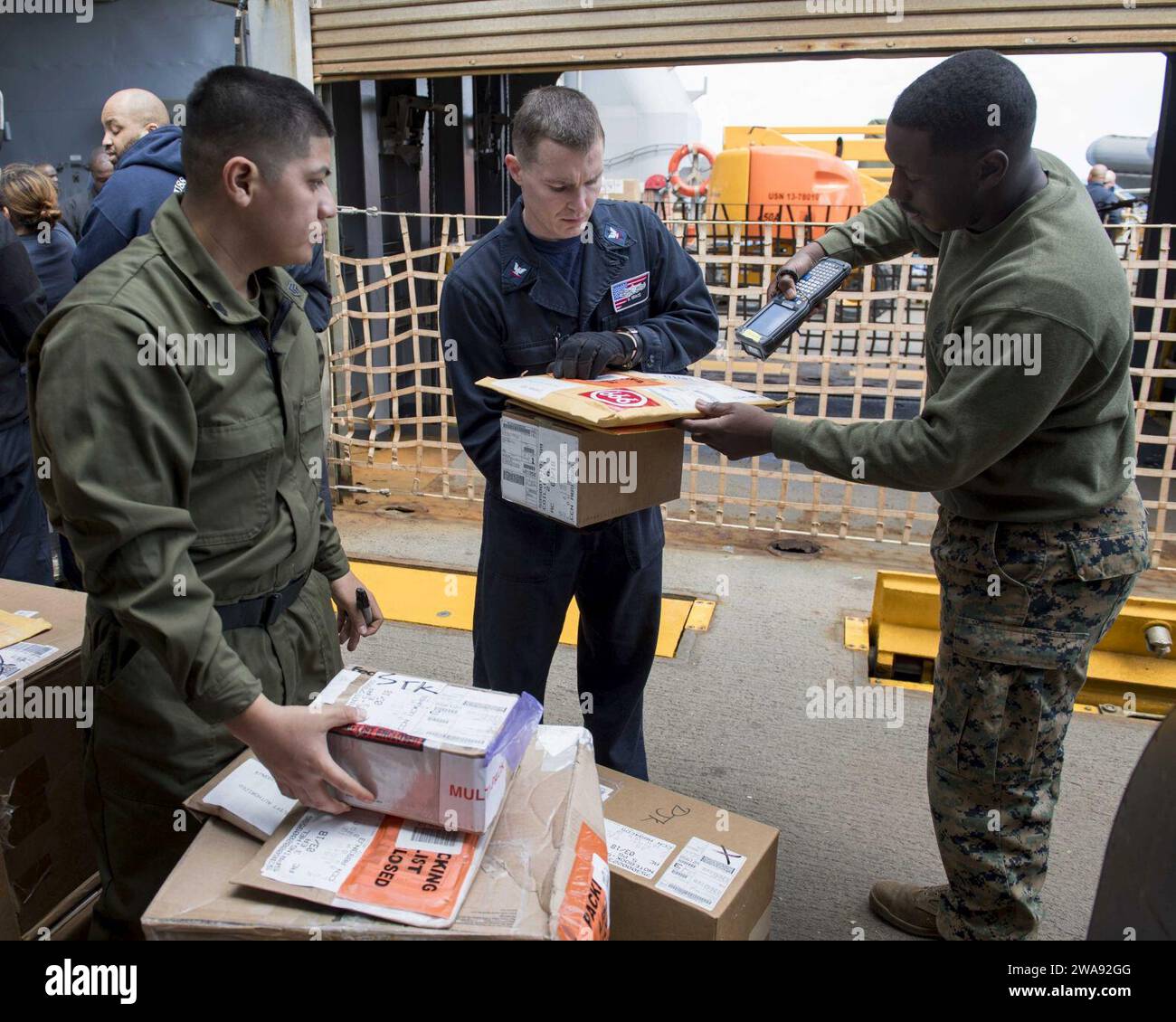 US military forces. 180324TJ319-0065 MEDITERRANEAN SEA (March 24, 2018) Marine Corps Sgt. Pilar Vasquez, left, Logistics Specialist 3rd Class Daniel Grace, center, and Marine Corps Cpl. Travis Robinson sort mail on the boat deck of the Harpers Ferry-class dock landing ship USS Oak Hill (LSD 51) March 24, 2018. Oak Hill, homeported in Virginia Beach, Virginia, is conducting naval operations in the U.S. 6th Fleet area of operations. (U.S. Navy photo by Mass Communication Specialist 3rd Class Jessica L. Dowell/Released) Stock Photo