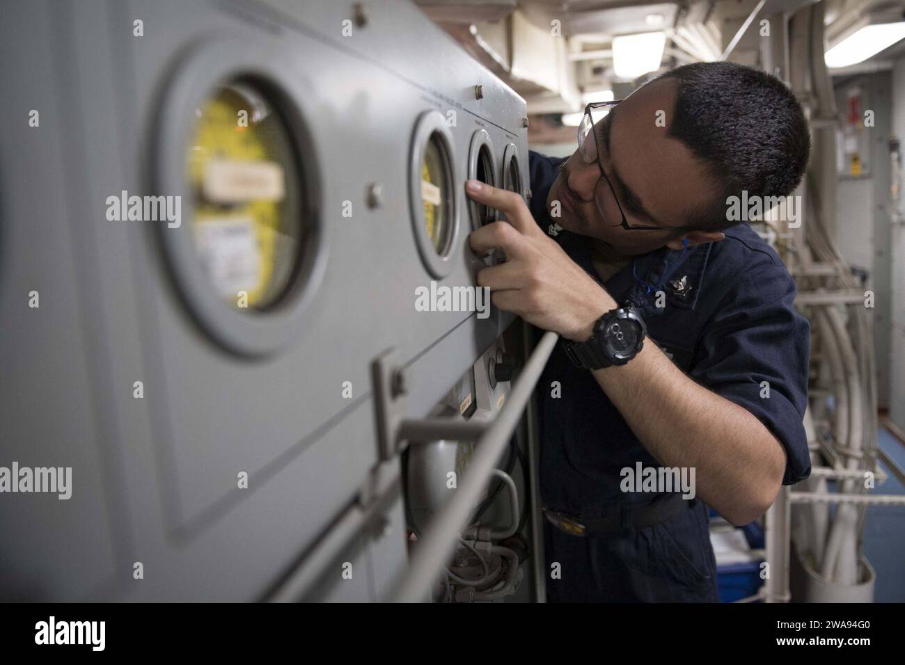 US military forces. 180425KP946-0050 MEDITERRANEAN SEA   (April 25, 2018) Fire Controlman (Aegis) 2nd Class Bogdan Bosneanu, from Tamarac, Florida, replaces chilled water gages aboard the Arleigh Burke-class guided-missile destroyer USS Donald Cook (DDG 75) April 25, 2018.  Donald Cook, forward-deployed to Rota, Spain, is on its seventh patrol in the U.S. 6th Fleet area of operations in support of regional allies and partners, and U.S. national security interests in Europe and Africa. (U.S. Navy photo by Mass Communication Specialist 2nd Class Alyssa Weeks / Released) Stock Photo