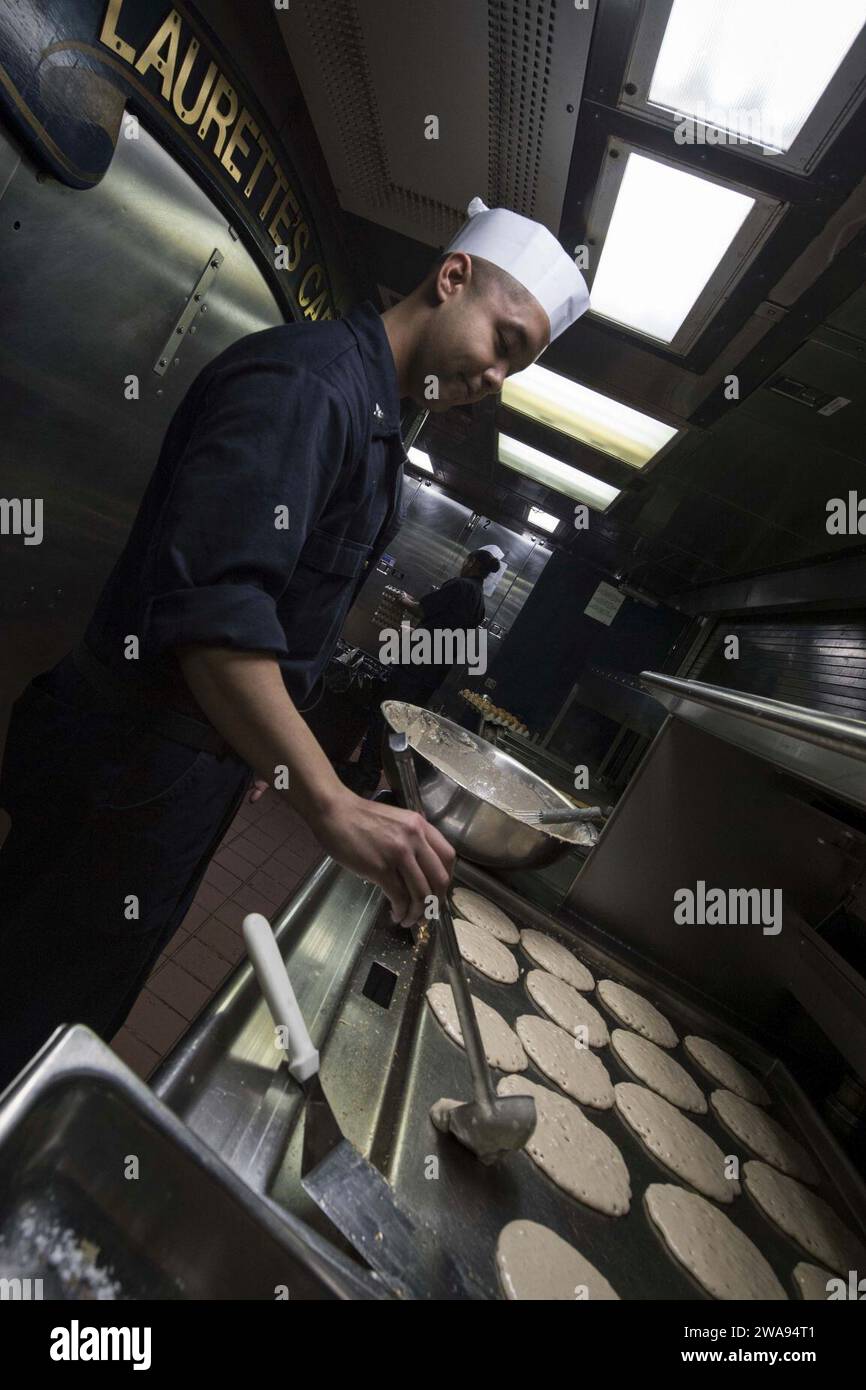 US military forces. 180429KP946-0017 MEDITERRANEAN SEA  (April 29, 2018) Culinary Specialist 2nd Class Julian Fuenzalida, from Houston,  prepares pancakes aboard the Arleigh Burke-class guided-missile destroyer USS Donald Cook (DDG 75) April 29, 2018.  Donald Cook, forward-deployed to Rota, Spain, is on its seventh patrol in the U.S. 6th Fleet area of operations in support of regional allies and partners, and U.S. national security interests in Europe and Africa. (U.S. Navy photo by Mass Communication Specialist 2nd Class Alyssa Weeks / Released) Stock Photo