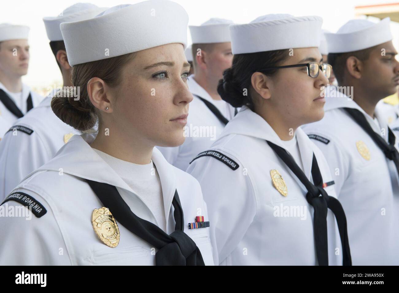 US military forces. 180501BK435-0020 DEVESELU, Romania (May 1, 2018) Sailors at Naval Support Facility (NSF) Deveselu, Romania, stand in formation for a dress white uniform inspection May 1, 2018. NSF Deveselu and AAMDS Romania are co-located with the Romanian 99th Military Base and play a key role in ballistic missile defense in Eastern Europe. (U.S. Navy photo by Mass Communication Specialist 1st Class Jeremy Starr/Released) Stock Photo