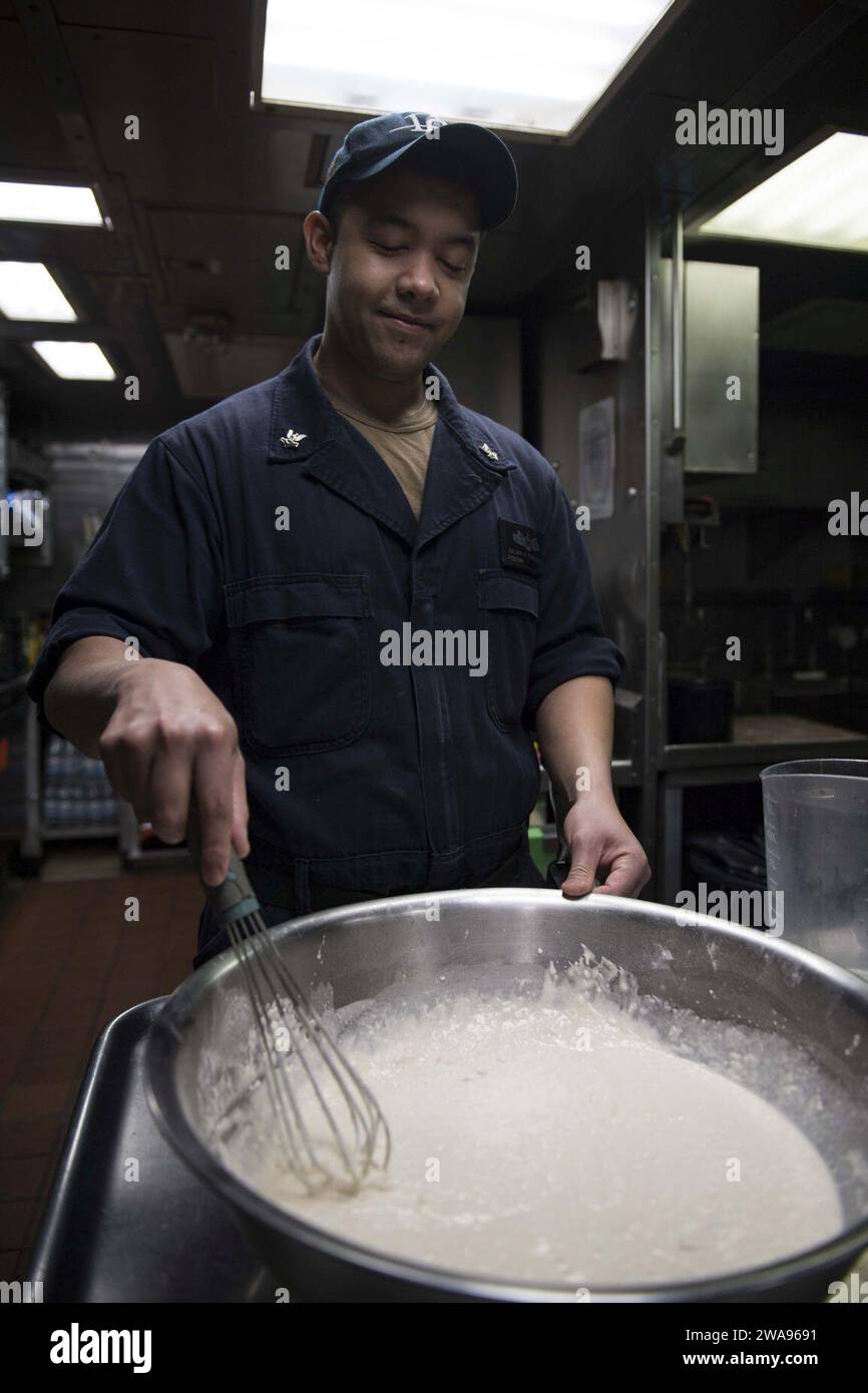 US military forces. 180512KP946-0001 NAVAL SUPPORT ACTIVITY SOUDA BAY, Greece  (May 12, 2018) Culinary Specialist 2nd Class Julian Fuenzalida, from Houston, Texas, prepares food aboard the Arleigh Burke-class guided-missile destroyer USS Donald Cook (DDG 75), May 12, 2018. Donald Cook, forward-deployed to Rota, Spain, is on its seventh patrol in the U.S. 6th Fleet area of operations in support of regional allies and partners, and U.S. national security interests in Europe and Africa. (U.S. Navy photo by Mass Communication Specialist 2nd Class Alyssa Weeks / Released) Stock Photo