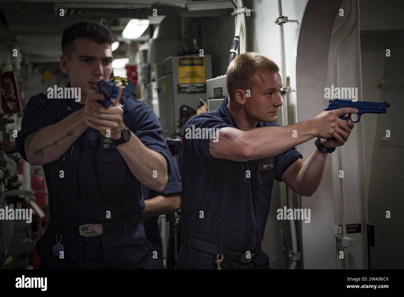 US military forces. 180514JI086-250 MEDITERRANEAN SEA (May 14, 2018) Hospital Corpsman 3rd Class Zach Haley, left, and Gunner's Mate Seaman Brian Price, both assigned to the Arleigh Burke-class guided-missile destroyer USS Porter (DDG 78), practice visit, board, search and seizure movements, May 14, 2018. Porter, forward-deployed to Rota, Spain, is on its fifth patrol in the U.S. 6th Fleet area of operations in support of U.S. national security interests in Europe and Africa. (U.S. Navy photo by Mass Communication Specialist 3rd Class Ford Williams/Released) Stock Photo