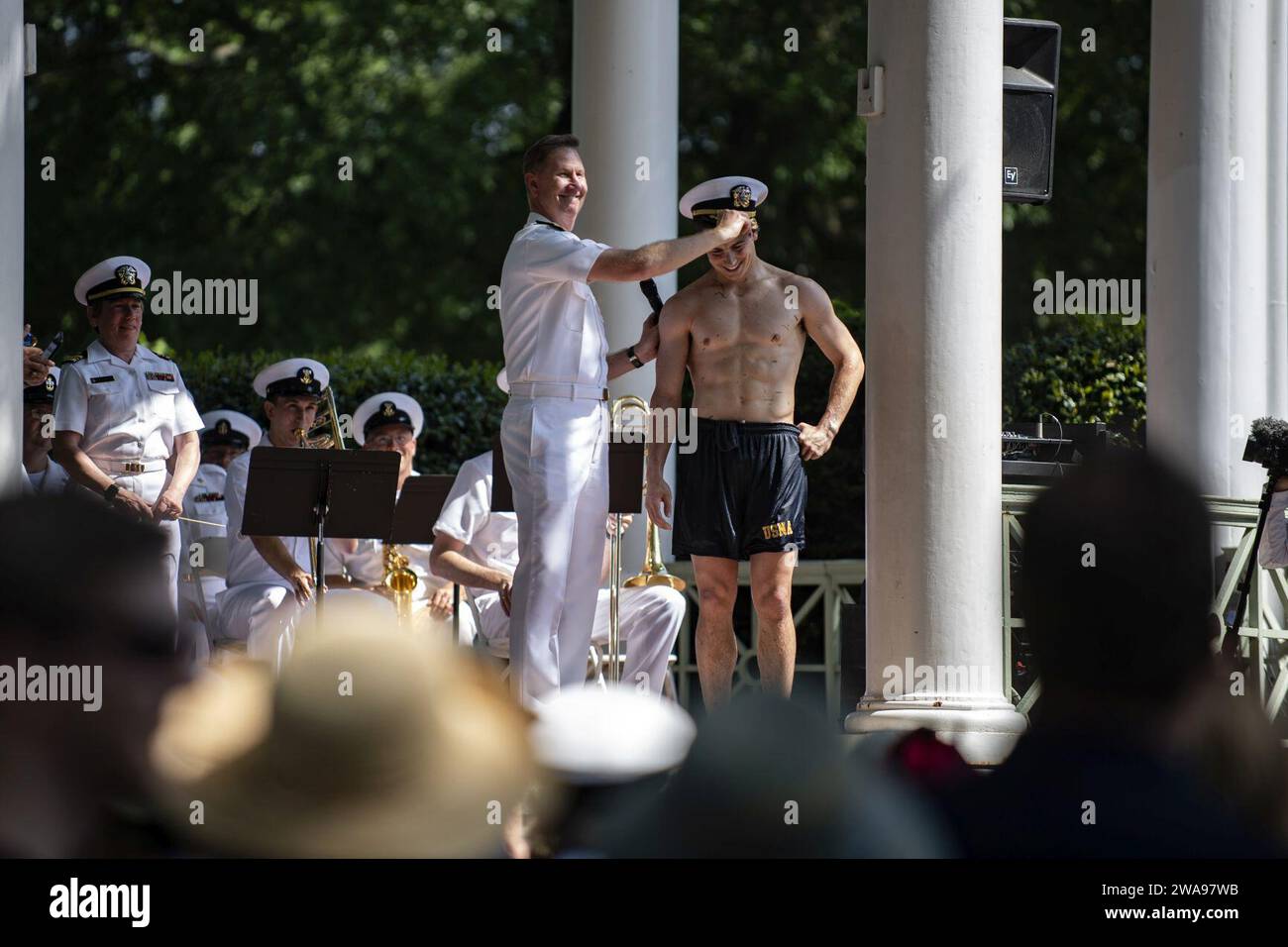 US military forces. ANNAPOLIS, Md. (May 21, 2018) Vice Adm. Ted Carter, superintendent of the U.S. Naval Academy, congratulates Midshipman 4th Class Peter Rossi, from Phoenix, Az., after the Herndon Climb. Each year, the roughly 1,000 members of the academy's plebe class form a human pyramid around the 21-foot Herndon Monument to remove a plebe hat, or Dixie cup, that upperclassmen have placed on the top of the obelisk monument which is covered in lard. (U.S. Navy photo by Mass Communication Specialist 3rd Class Kaitlin Rowell/Released) Stock Photo