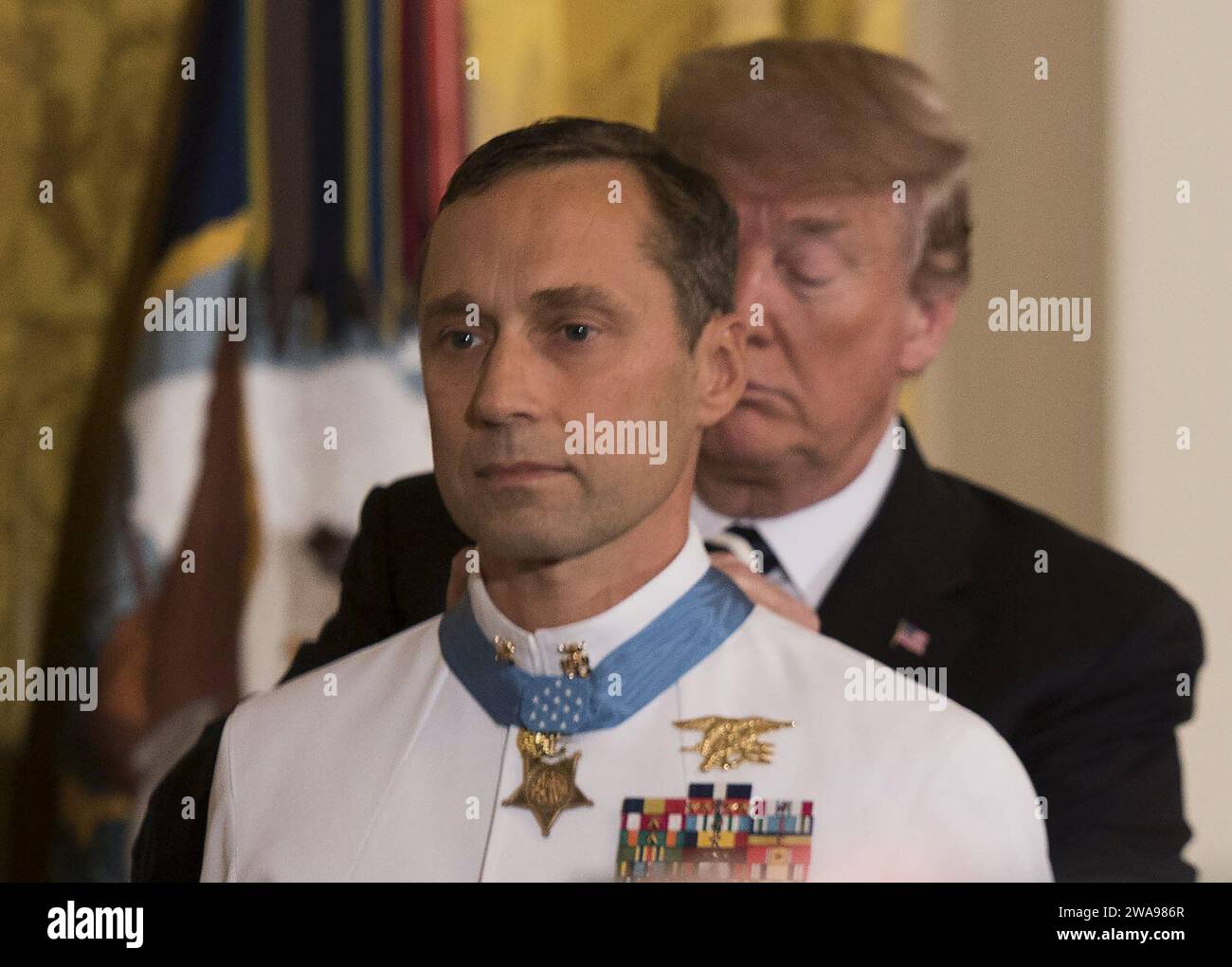 US military forces. 180524BB269-003 WASHINGTON (May 24, 2018) President Donald J. Trump presents the Medal of Honor to retired Master Chief Special Warfare Operator (SEAL) Britt Slabinski during a ceremony at the White House in Washington, D.C. Slabinski received the Medal of Honor for his actions during Operation Anaconda in Afghanistan in March 2002. (U.S. Navy photo by Mass Communication Specialist 1st Class Raymond D. Diaz III/Released) Stock Photo