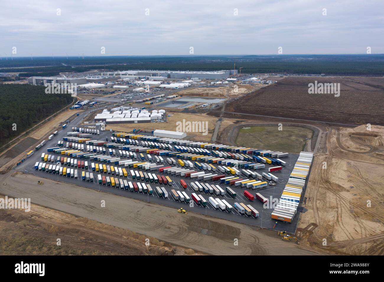 View of the Tesla Giga Factory site, with containers and swap trailers ...