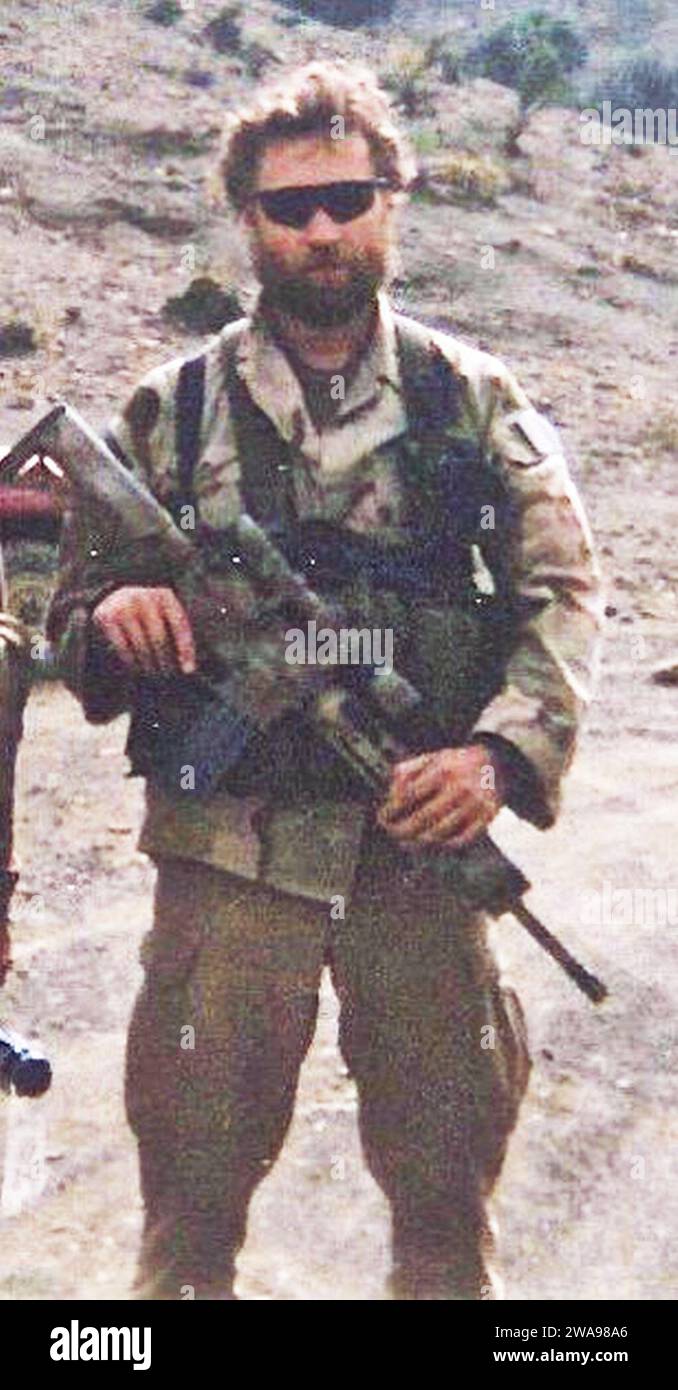 US military forces. 180524N0101-213 WASHINGTON (May 24, 2018) A file photo taken in March 2002 of Senior Chief Special Warfare Operator (SEAL) Britt K. Slabinski in Afghanistan. President Donald J. Trump awarded the Medal of Honor to Slabinski during a White House ceremony May 24, 2018 for his heroic actions during the Battle of Takur Ghar in March 2002 while serving in Afghanistan. Slabinski was recognized for his actions while leading a team under heavy effective enemy fire in an attempt to rescue SEAL teammate Petty Officer 1st Class Neil Roberts during Operation Anaconda in 2002. The Medal Stock Photo