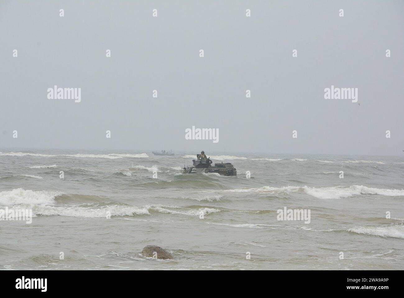 US military forces. 180604WF810-010 KLAIPEDA, Lithuania (June 4, 2018) An AAV-P7/A1 assault amphibious vehicle (USMC), carrying U.S. and Romanian Marine personnel moves towards the shore during a simulated amphibious assault as part of Baltic Operations (BALTOPS) 2018. BALTOPS is the premier annual maritime-focused exercise in the Baltic region and one of the largest exercises in Northern Europe enhancing flexibility and interoperability among allied and partner nations. (U.S. Navy photo by Mass Communication Specialist 1st Class Adam C. Stapleton/Released) Stock Photo