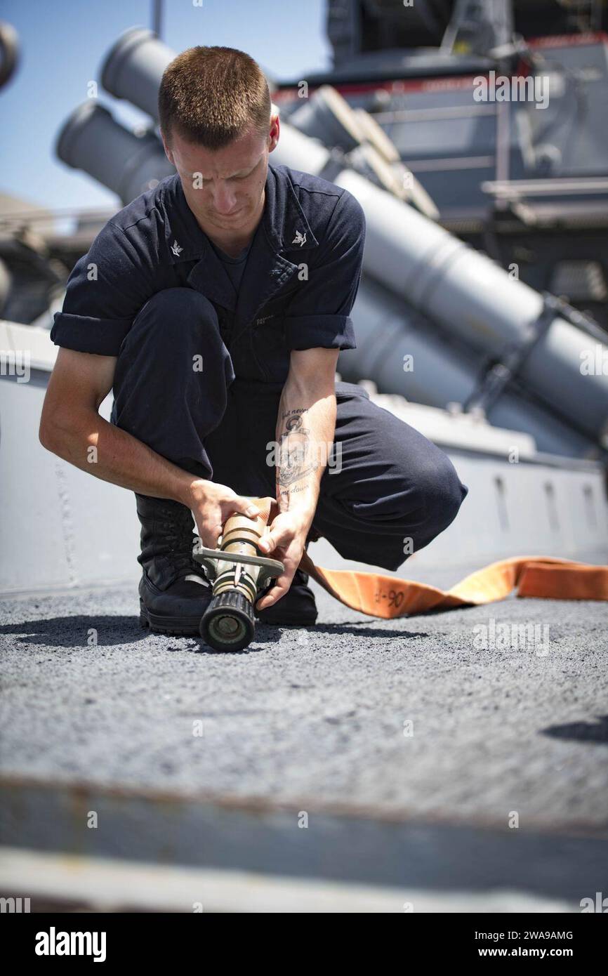 US military forces. 180607JI086-012 MEDITERRANEAN SEA (June 7, 2018) Personnel Specialist 3rd Class Damien Johnson, assigned to the Arleigh Burke-class guided-missile destroyer USS Porter (DDG 78), lays out a firehose during a flight deck firefighting drill, June 7, 2018. Porter, forward-deployed to Rota, Spain, is on its fifth patrol in the U.S. 6th Fleet area of operations in support of U.S. national security interests in Europe and Africa. (U.S. Navy photo by Mass Communication Specialist 3rd Class Ford Williams/Released) Stock Photo