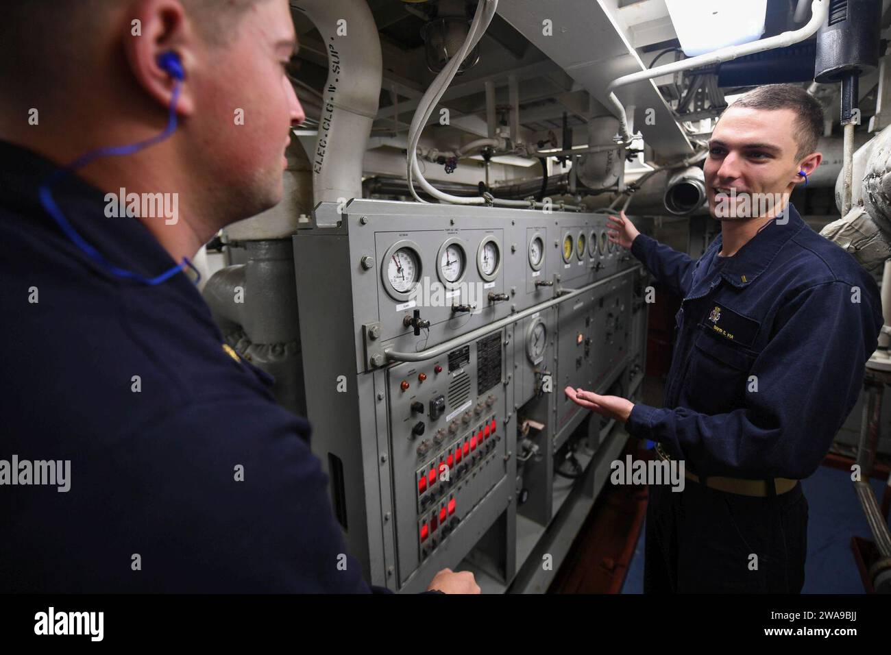 US military forces. 180612FP878-032 BALTIC SEA (June 12, 2018) Ensign David Via, from Wilson, North Carolina, right, gives a tour of the auxiliary machinery room to Midshipman 1st Class Thomas Newton, from Mechanicsville, Virginia, aboard the Arleigh Burke-class guided-missile destroyer USS Bainbridge (DDG 96) during exercise Baltic Operations (BALTOPS) 2018 June 12. BALTOPS is the premier annual maritime-focused exercise in the Baltic Region and one of the largest exercises in Northern Europe enhancing flexibility and interoperability among allied and partner nations. (U.S. Navy photo by Mass Stock Photo