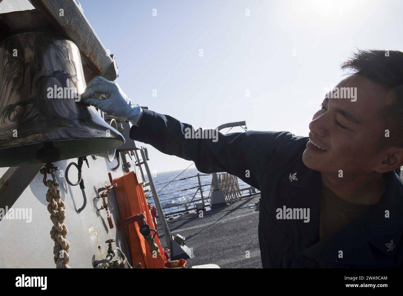 US military forces. 180618KP946-0002 MEDITERRANEAN SEA (June 18, 2018) Culinary Specialist 3rd Class Rjraphael Calaguas, from Woodbridge, Virginia, shines a bell aboard the Arleigh Burke-class guided-missile destroyer USS Donald Cook (DDG 75) June 18, 2018. Donald Cook, forward-deployed to Rota, Spain, is on its seventh patrol in the U.S. 6th Fleet area of operations in support of regional allies and partners, and U.S. national security interests in Europe and Africa. (U.S. Navy photo by Mass Communication Specialist 2nd Class Alyssa Weeks / Released) Stock Photo