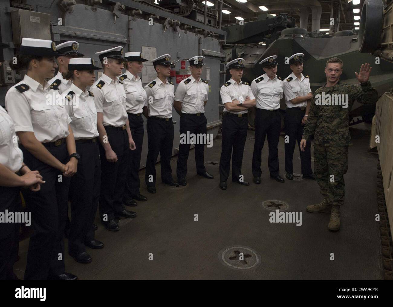 US military forces. 180623TJ319-0073 GDYNIA, Poland (June 23, 2018) U.S. Marines Cpl. Thomas Monahan, from Freehold, New Jersey, speaks with students from the Polish Naval Academy about an M1/A1 Abrams tank during a tour aboard the Harpers Ferry-class dock landing ship USS Oak Hill (LSD 51), June 23, 2018. Oak Hill, homeported in Virginia Beach, Virginia, is conducting naval operations in the U.S. 6th Fleet area of operations. (U.S. Navy photo by Mass Communication Specialist 3rd Class Jessica L. Dowell/Released) Stock Photo