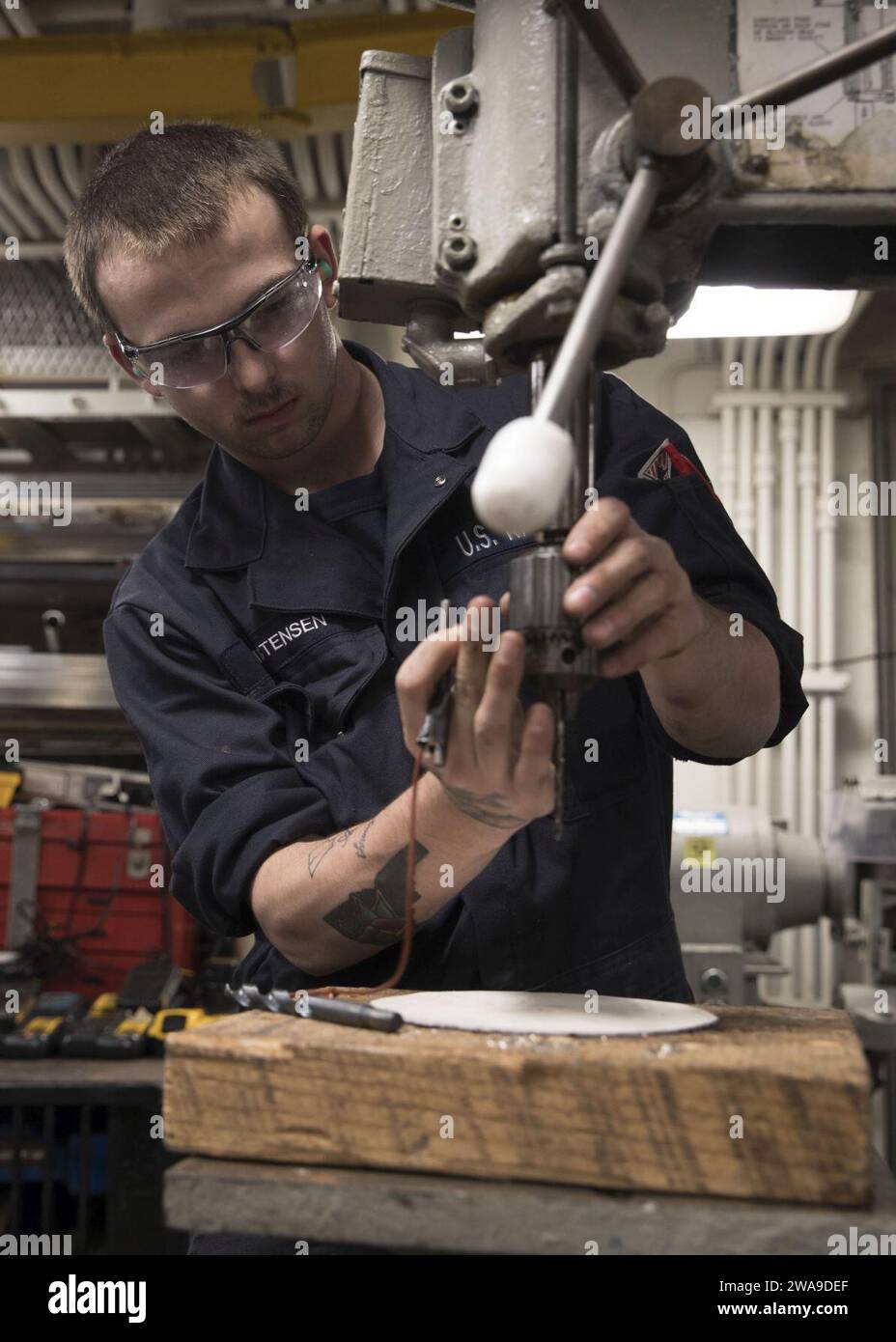 US military forces. 180628GY005-0033 STRAIT OF GIBRALTAR (June 28, 2018) Hull Maintenance Technician Fireman Ethan Christensen prepares a screw in a drill aboard the Nimitz-class aircraft carrier USS Harry S. Truman (CVN 75). Harry S. Truman is currently deployed as part of an ongoing rotation of U.S. forces supporting maritime security operations in international waters around the globe (U.S. Navy photo by Mass Communication Specialist 3rd Class Gitte Schirrmacher/Released) Stock Photo