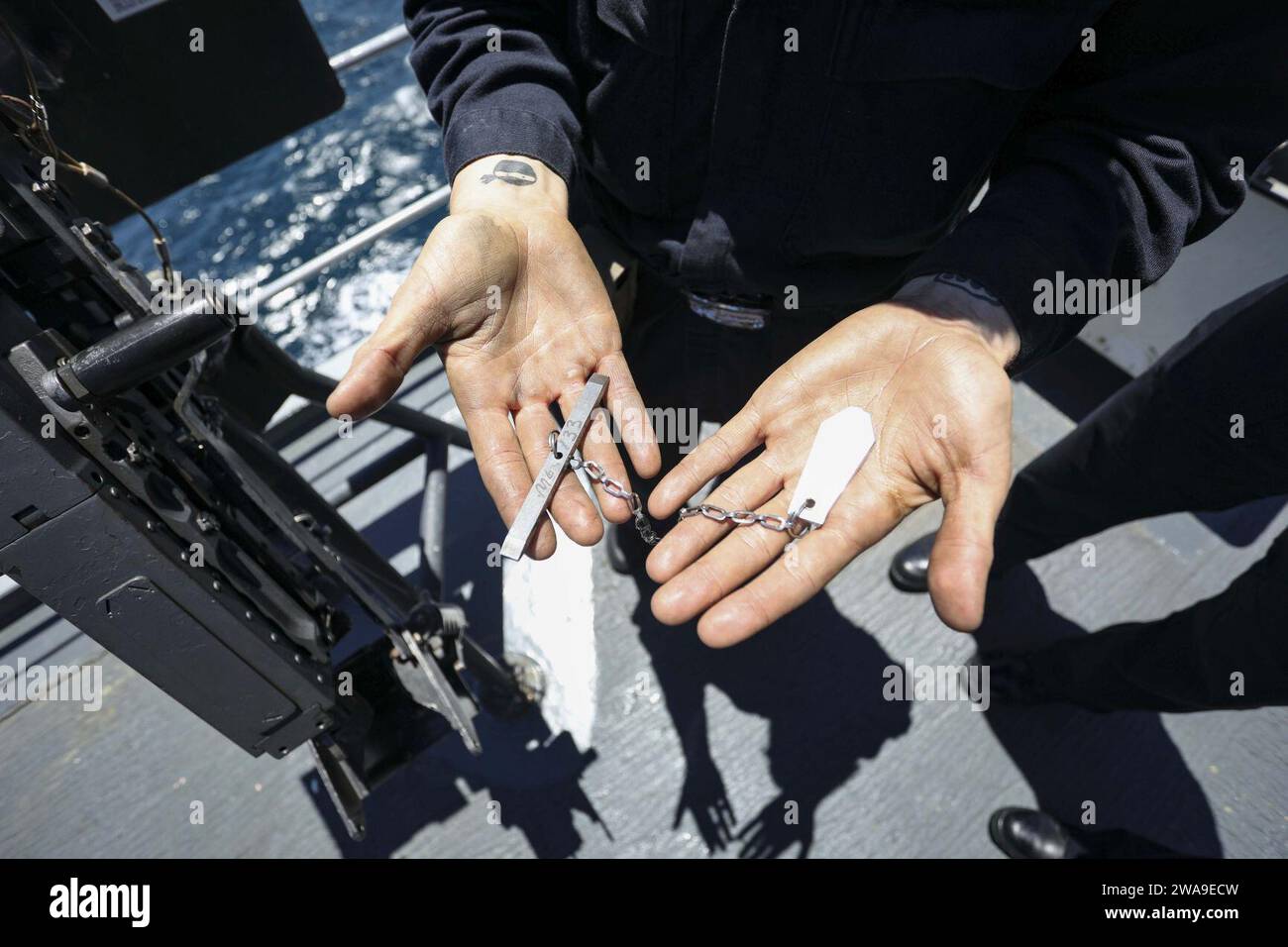 US military forces. 180701XT273-168 MEDITERRANEAN SEA (July 1, 2018) Gunner’s Mate 2nd Class Christina Nichols demonstrates how to do maintenance on a .50-caliber machine gun aboard the Blue Ridge-class command and control ship USS Mount Whitney (LCC 20) in the Mediterranean Sea, July 1, 2018. Mount Whitney, forward-deployed to Gaeta, Italy, operates with a combined crew of U.S. Navy Sailors and Military Sea Lift Command civil service mariners. (U.S. Navy photo by Mass Communication Specialist 1st Class Justin Stumberg/Released) Stock Photo