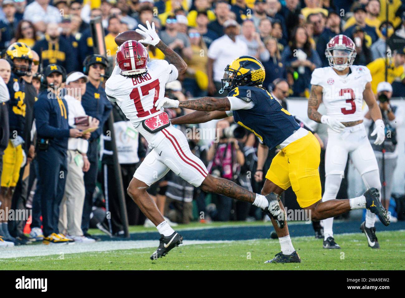 Alabama Crimson Tide wide receiver Isaiah Bond (17) makes a catch against Michigan Wolverines defensive back Keon Sabb (3) during the CFP Semifinal at Stock Photo